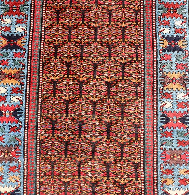 19th Century Antique Persian Kurdish Long Gallery Runner with Repeating Tribal Motif Design For Sale