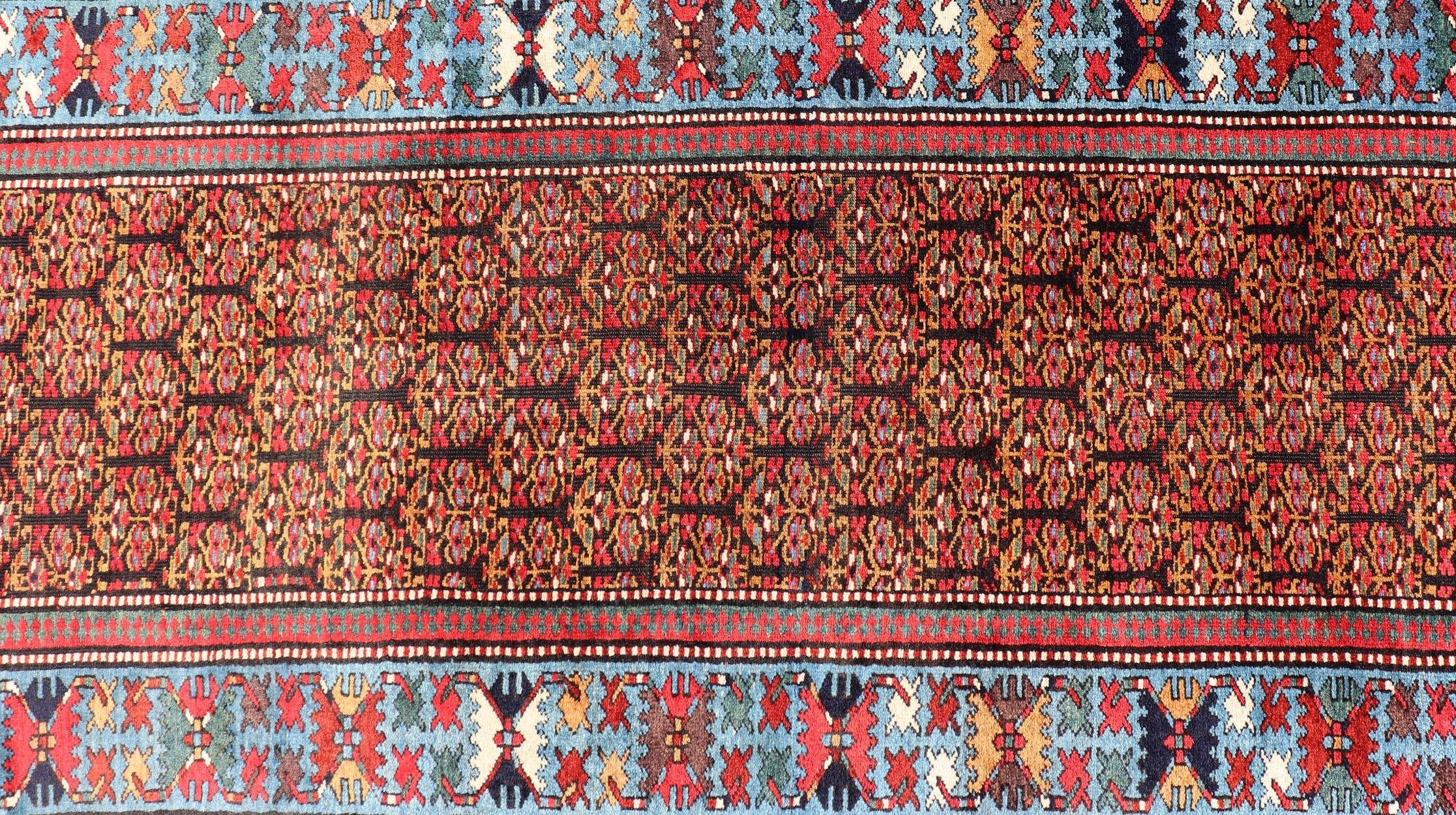Antique Persian Kurdish Long Gallery Runner with Repeating Tribal Motif Design For Sale 1