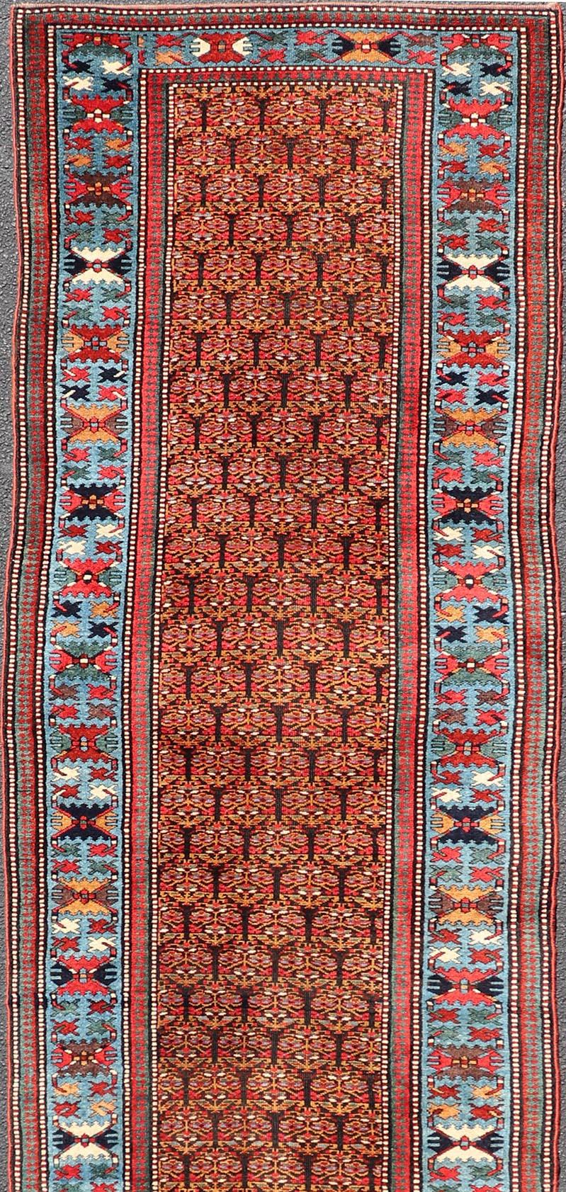 Antique Persian Kurdish Long Gallery Runner with Repeating Tribal Motif Design For Sale 2