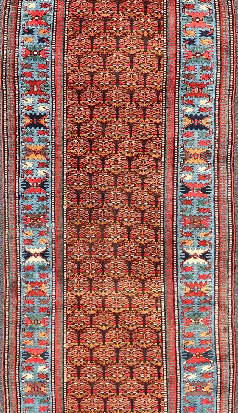 Antique Persian Kurdish Long Gallery Runner with Repeating Tribal Motif Design For Sale 3