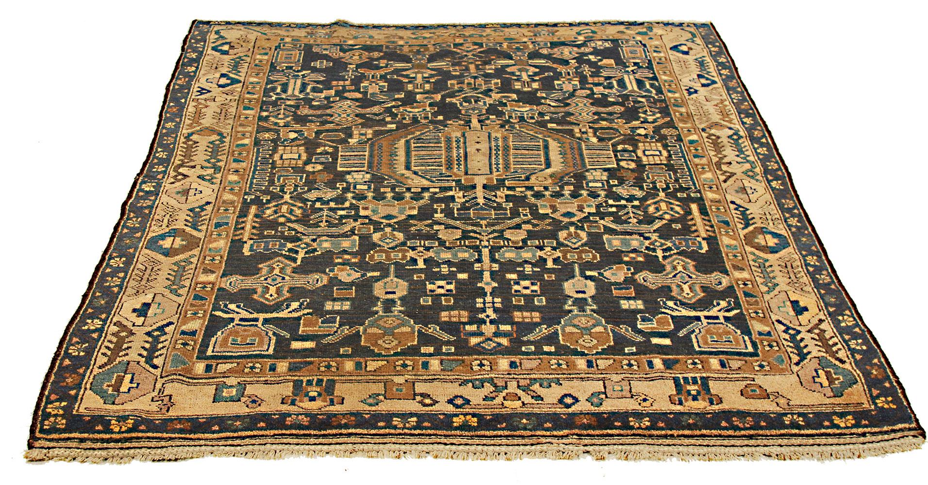 Antique Persian rug handwoven from the finest sheep’s wool and colored with all-natural vegetable dyes that are safe for humans and pets. It’s a traditional Kurdish design highlighted by large and small geometric medallions in blue and brown over a