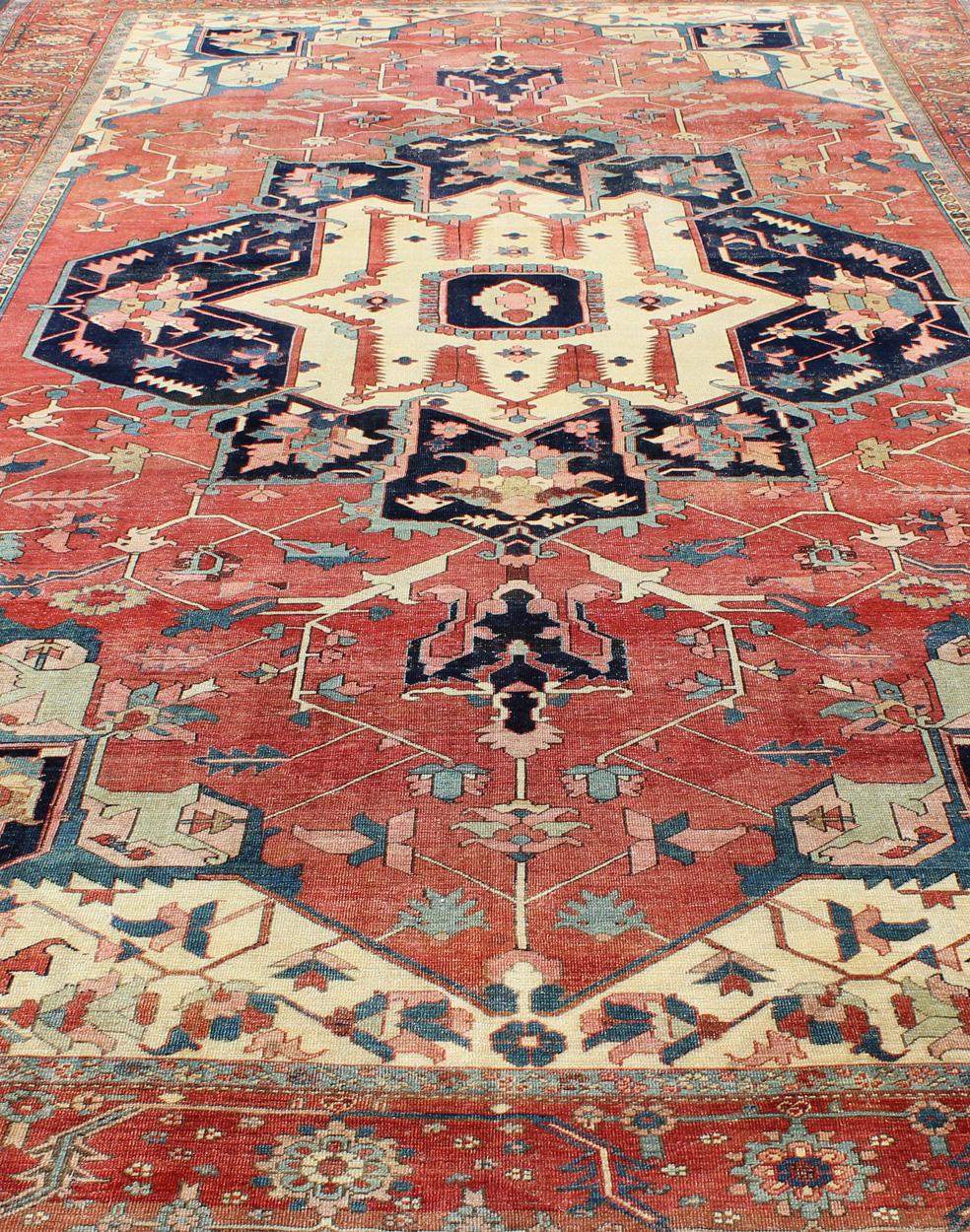Large Antique Persian Serapi Rug in Faded Red, Teal, Navy Blue, and Ivory For Sale 1