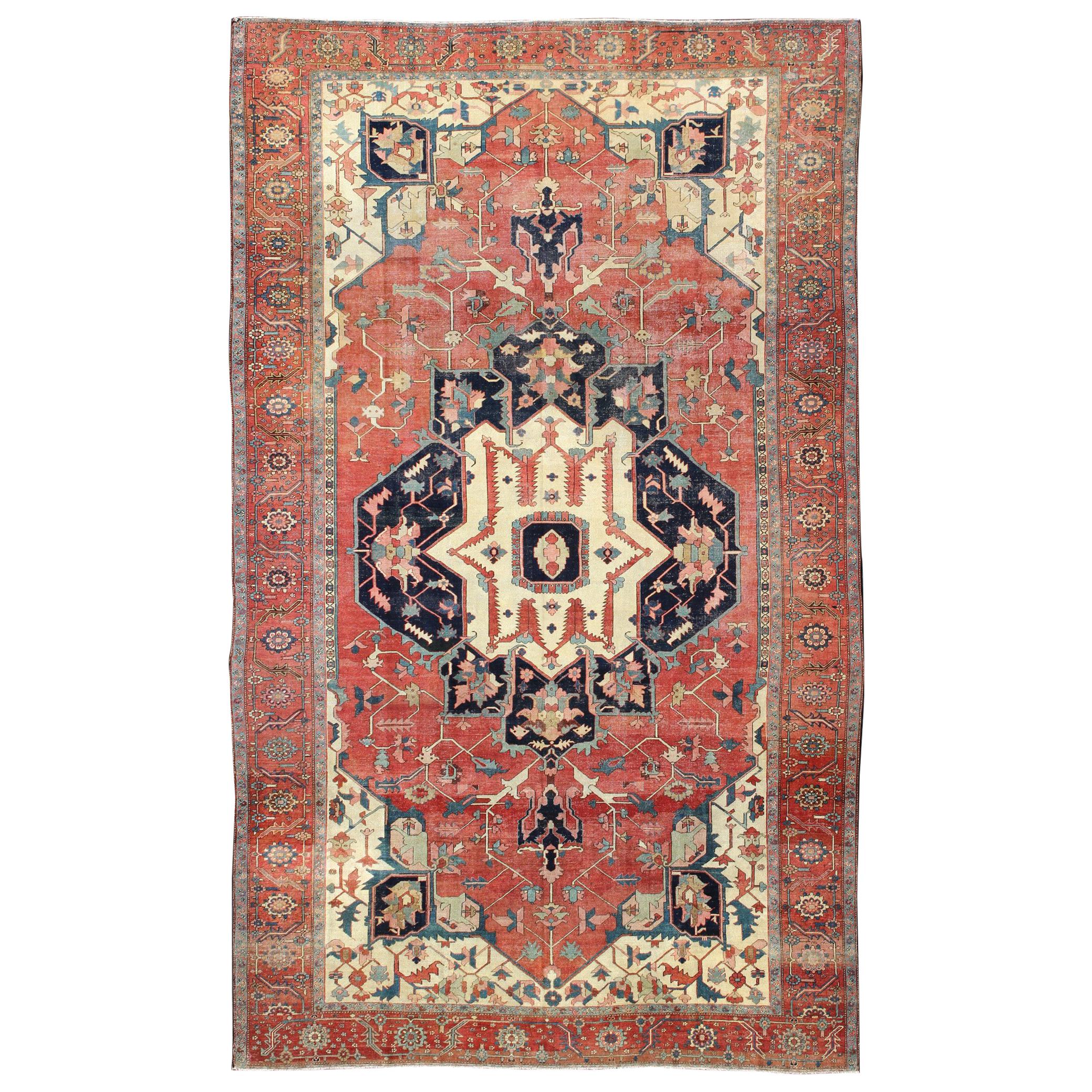 Large Antique Persian Serapi Rug in Faded Red, Teal, Navy Blue, and Ivory For Sale