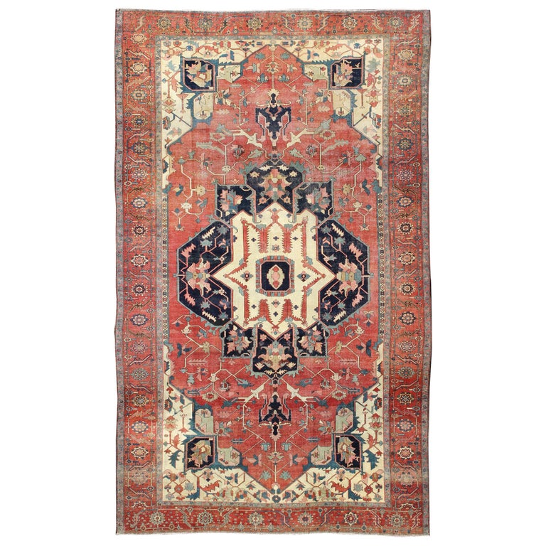 Large Antique Persian Serapi Rug in Faded Red, Teal, Navy Blue, and