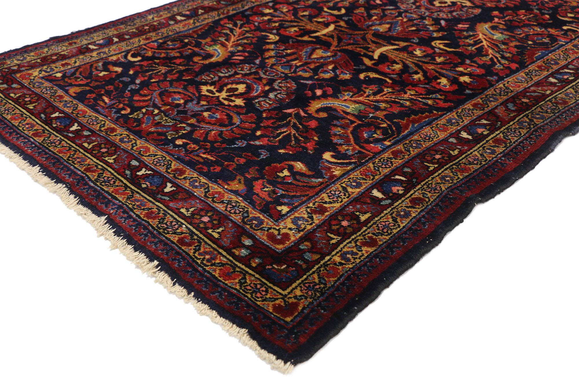 76857 Antique Persian Lilihan Accent rug with traditional floral motif. This ornate antique Persian Lilihan rug is rendered in deep sapphire blue, garnet red and cream on a luxurious field dotted with peacock hued lush flowers. Surrounded with a