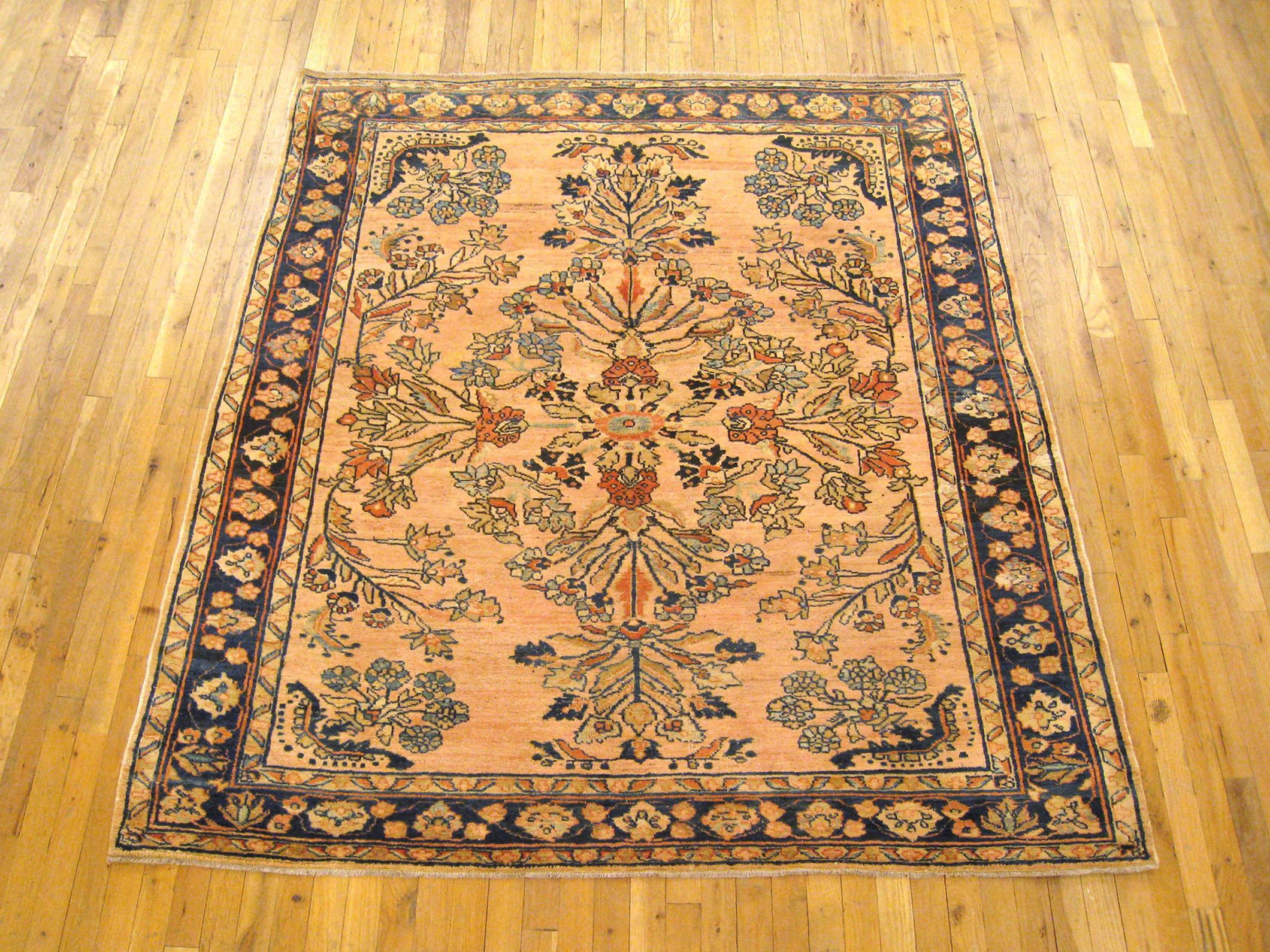 Antique Persian Lilihan rug, Room size, circa 1920

A one-of-a-kind antique Persian Lilihan Oriental Carpet, hand-knotted with soft wool pile. This fine hand-knotted wool rug features floral elements allover the salmon field, with an attractive
