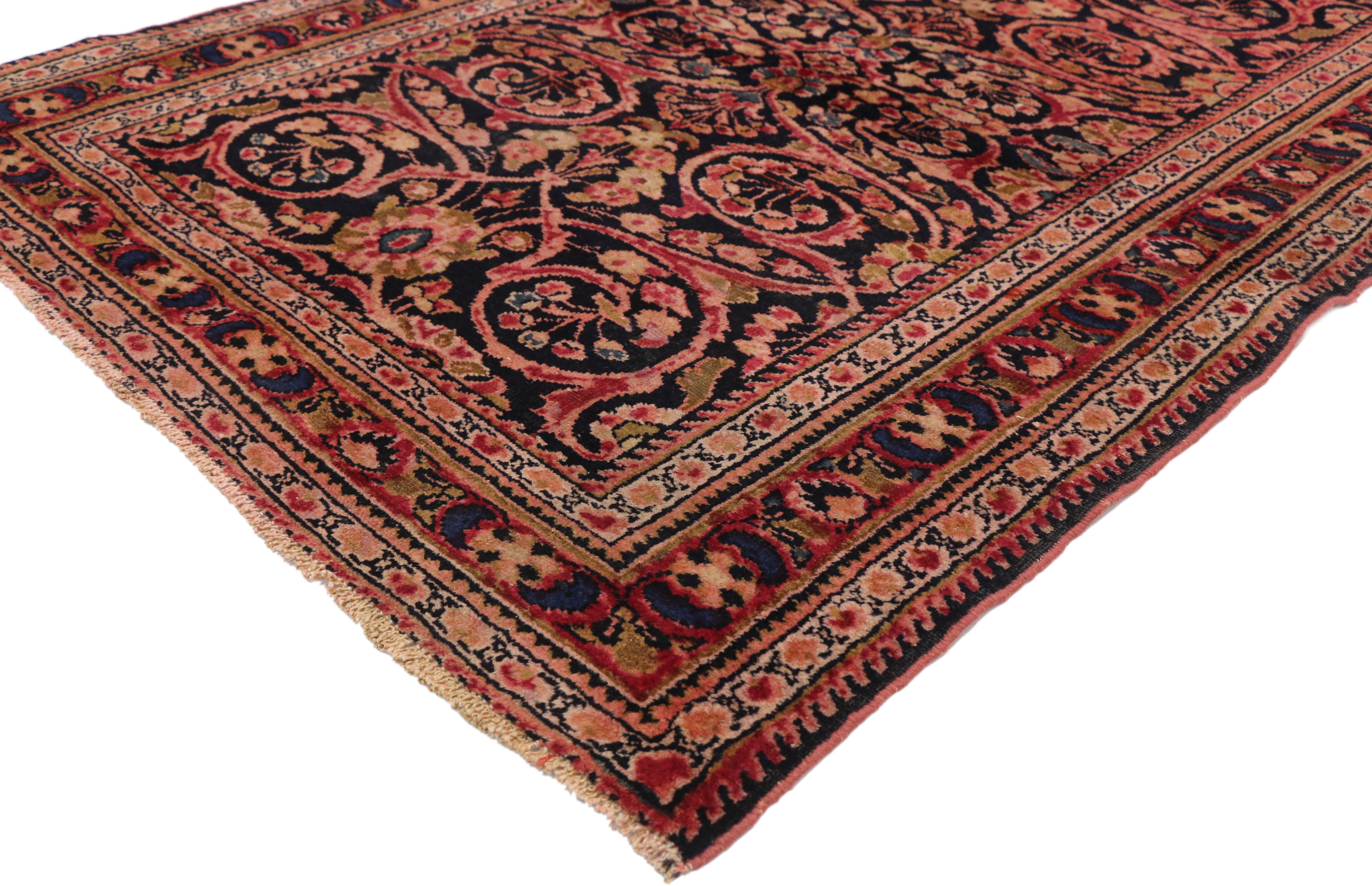 72381 antique Persian Lilihan rug with Baroque Renaissance style. This hand knotted wool antique Persian Lilihan rug features a graceful arabesque vine pattern dotted with flowers in red, pink, coral, salmon and azure on a field of navy blue. The