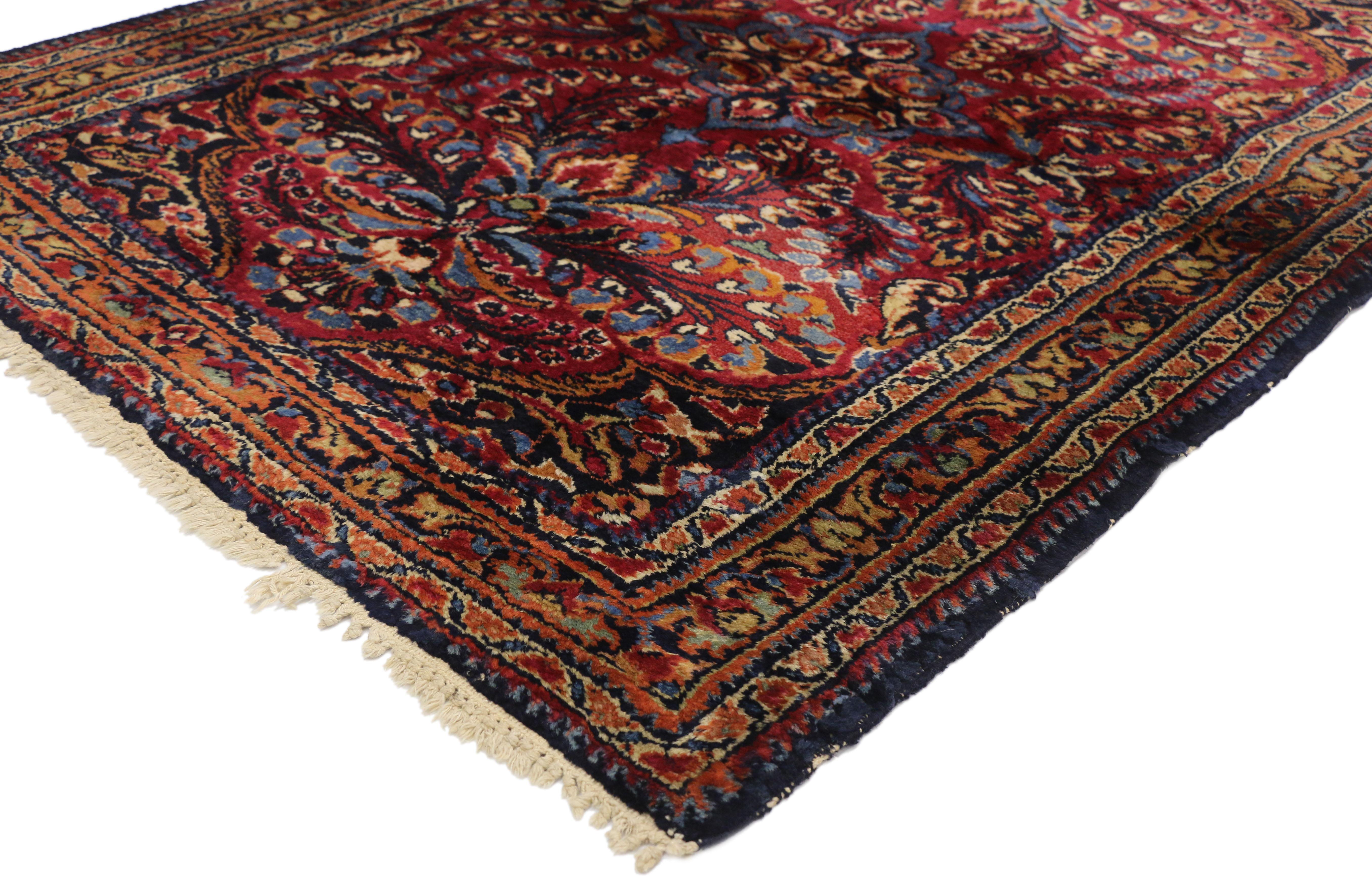 72590 Antique Persian Lilihan rug with Preppy Jacobean style. This hand knotted wool antique Persian Lilihan rug features an all-over floral pattern with a center cusped medallion set with a round floret and anchored by two fleur de lis pendants. A
