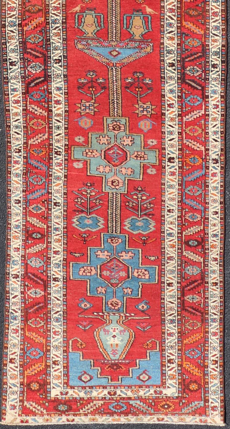 20th Century Antique Persian Long Persian Serapi Runner in Wool with Medallion Design For Sale