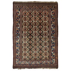 Antique Persian Lori Rug with Geometric All-Over Medallions in Black and Red