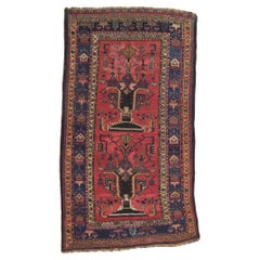 Antique Persian Lori Rug with Vase Design