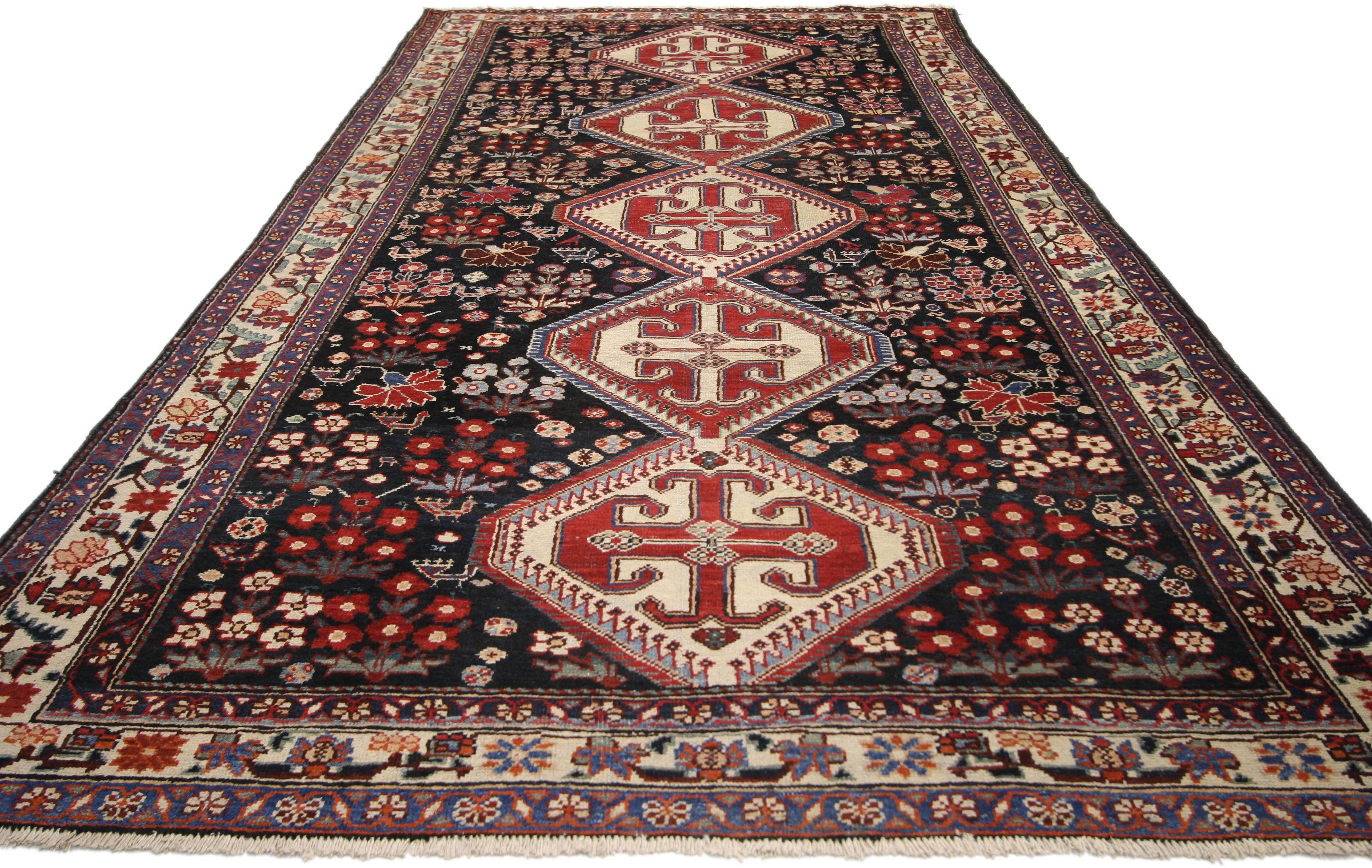 75266, antique Persian Mahal Amulet patterned rug with traditional style. This exquisite Persian Mahal rug with traditional style features a row of five amulets in alternating shades of deep persimmon and cream. The amulets rest on a field of onyx