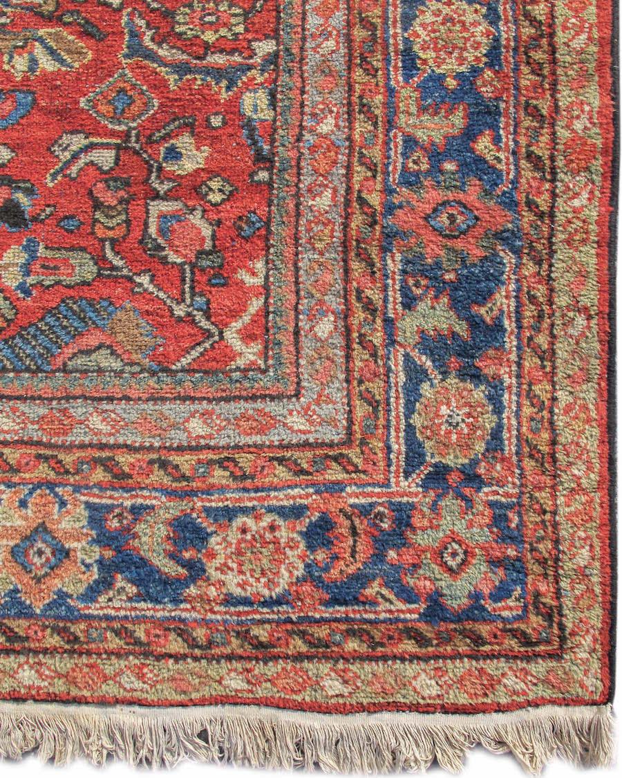 Antique Persian Mahal Rug, Early 20th Century

This intriguing square format Mahal draws a well articulated, large scale rendition of the ‘Herati pattern’ against an ochre ground. The ‘Herati pattern’ is a repeat design of foliage and blossoms