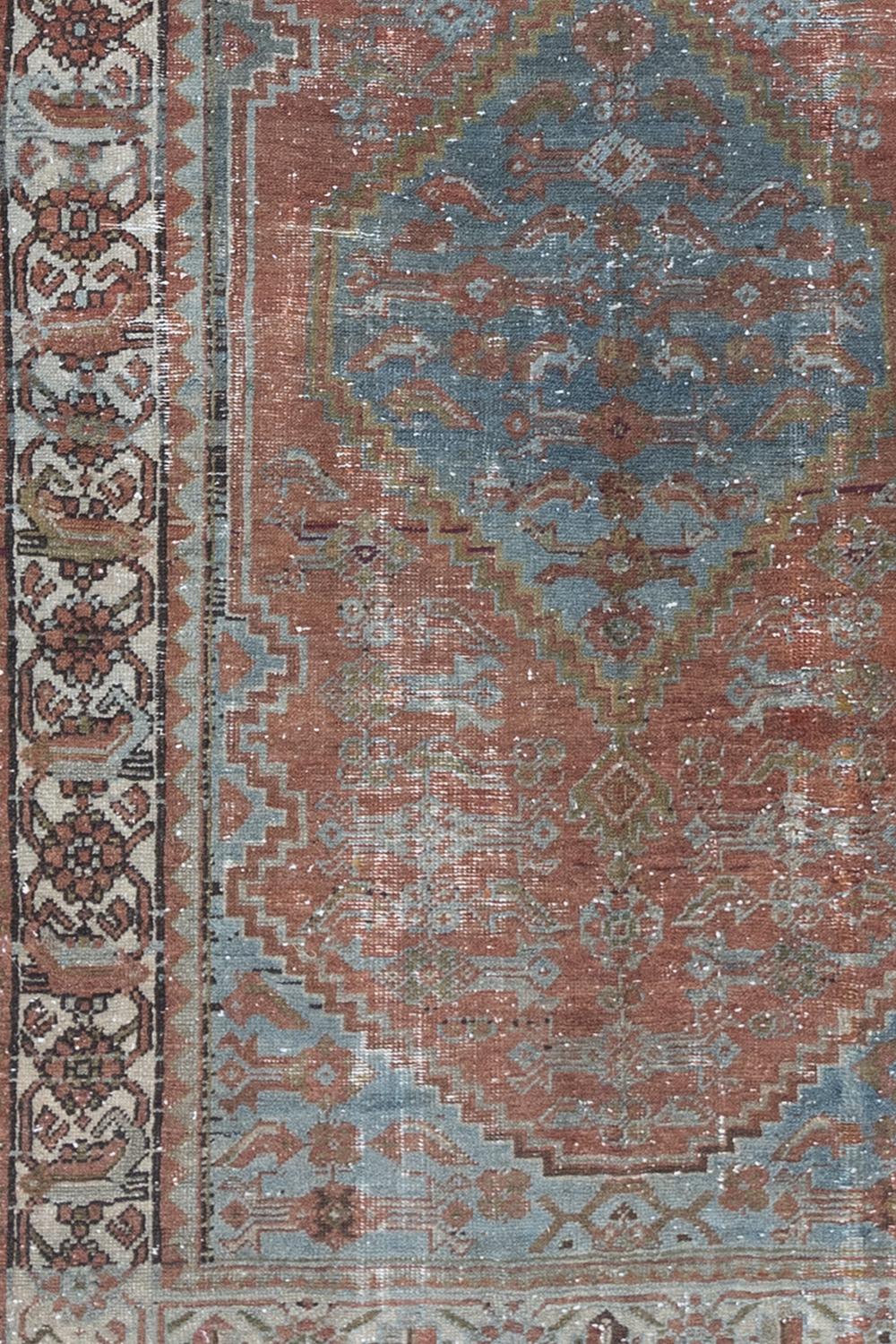 Age: Circa 1920

Colors: salmon, rust, blue, green

Pile: low

Wear Notes: 4

Material: wool on wool

Antique Persian Mahal woven in the early 20th century. 

Vintage rugs are made by hand over the course of months, sometimes years.