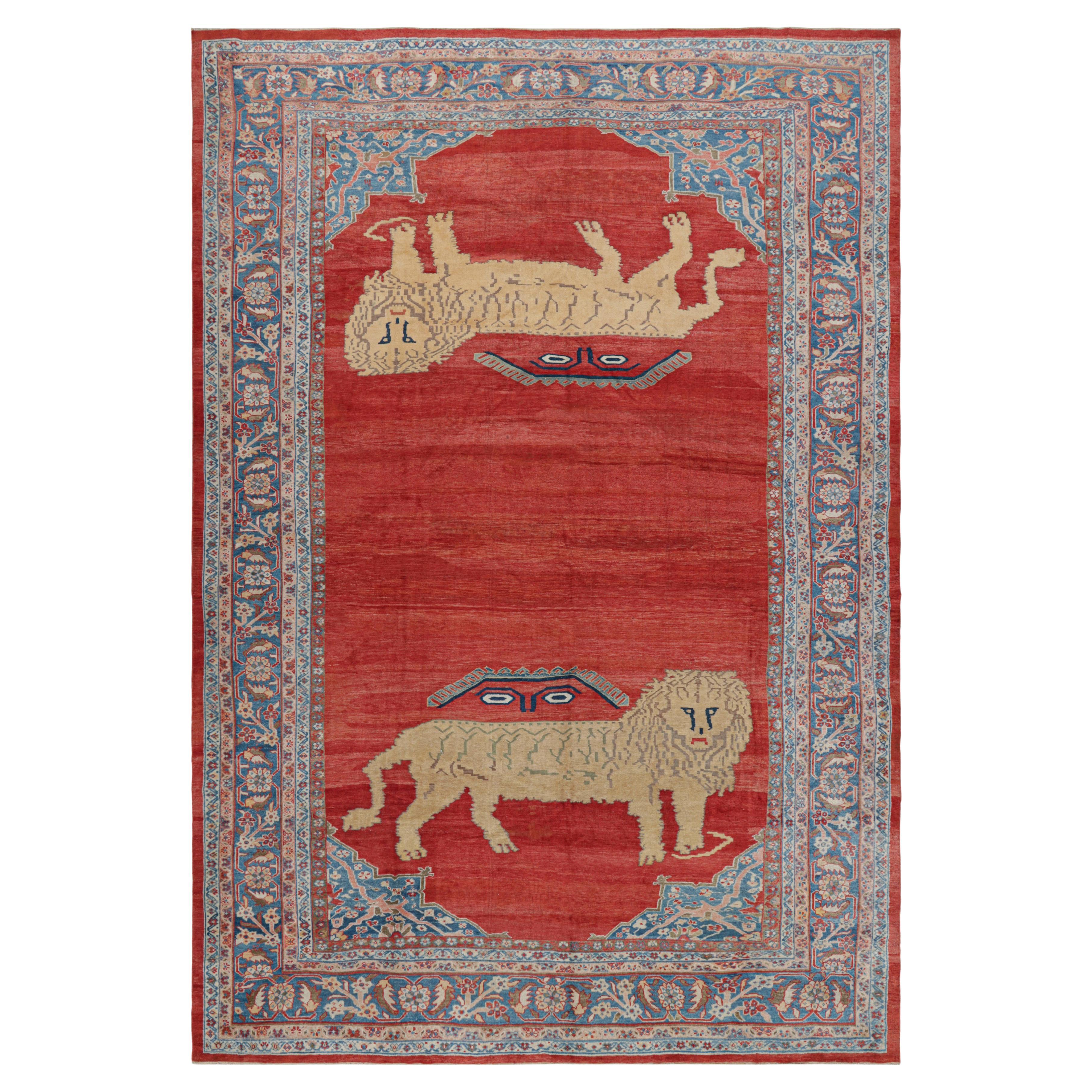 Alfombra persa antigua sobredimensionada en campo abierto rojo y leones pictóricos - Rug & Kilim en venta