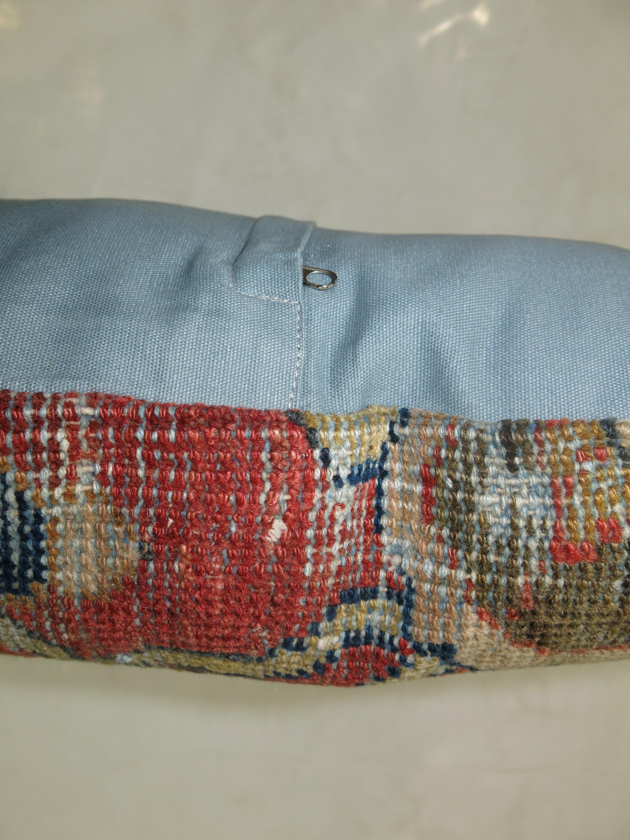 Pillow made from antique Persian rug with cotton back. Zipper closure and foam insert provided. Measures: 20” x 20”.