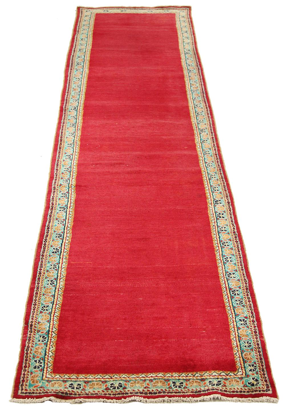 Antique Persian rug handwoven from the finest sheep’s wool and colored with all-natural vegetable dyes that are safe for humans and pets. It’s a traditional Mahal design featuring floral details along its border and a rich red field. It’s a lovely