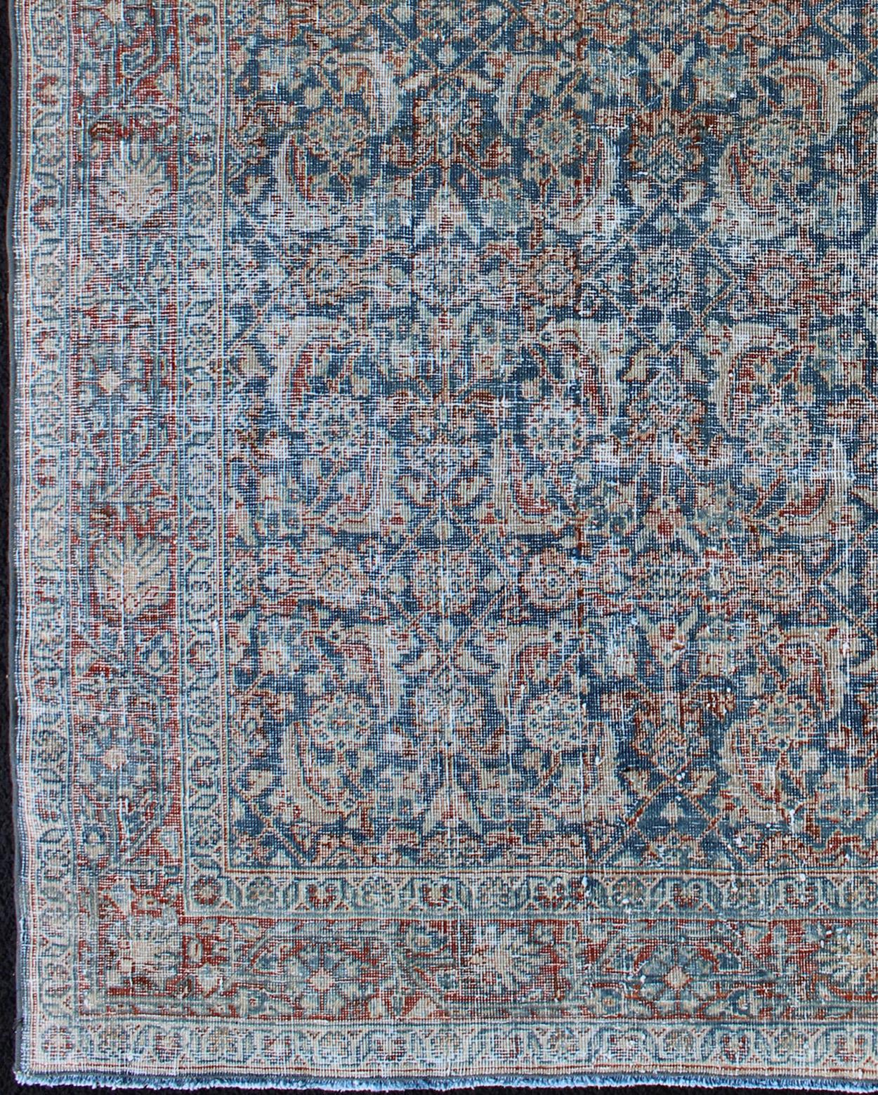 Mahal rug antique Persian with floral design in red, blue, ivory, cream tones, rug ema-7548, country of origin / type: Iran / Mahal, circa 1920

This antique Persian Mahal rug, circa early 20th century, relies heavily on exquisite details as well as
