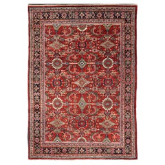 Tapis persan ancien Mahal avec motif sous-géométrique sur toute sa surface et fond rouge