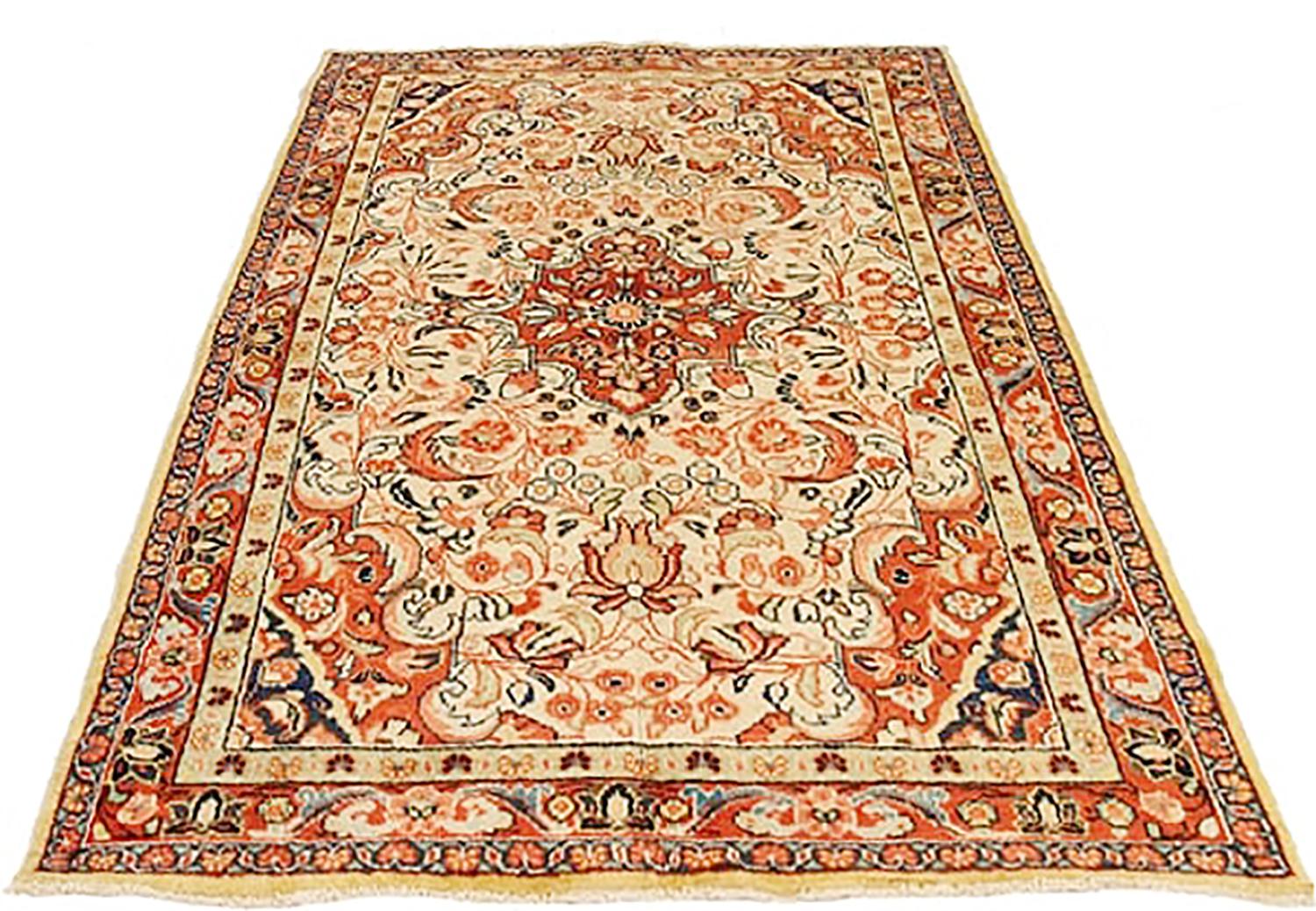 Antique Persian rug handwoven from the finest sheep’s wool and colored with all-natural vegetable dyes that are safe for humans and pets. It’s a traditional Mahal design featuring floral details in beige and rust over an ivory field. It’s a lovely
