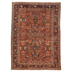 Tapis persan ancien Mahal avec motif floral bleu et vert sur fond rouge