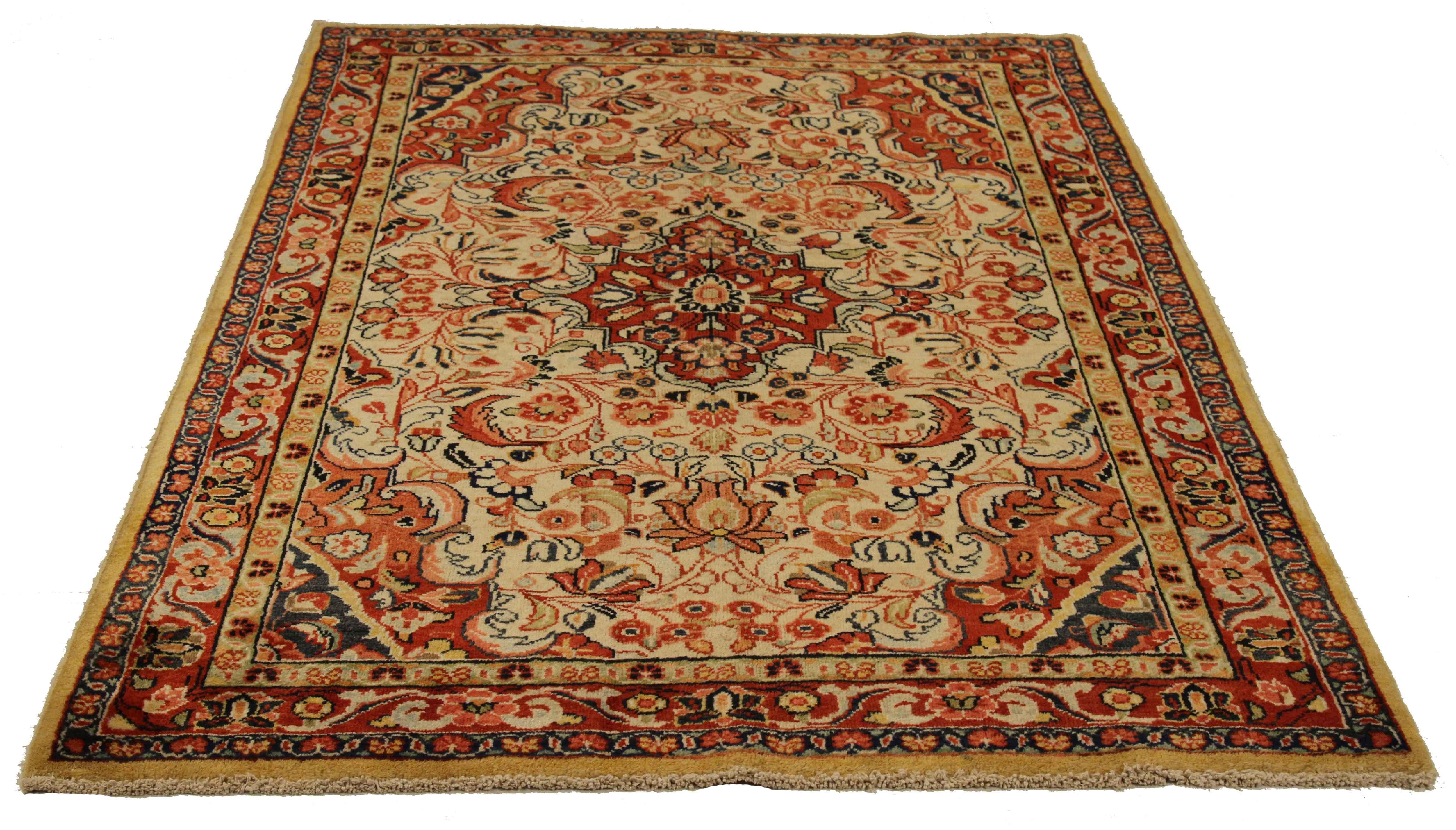Antique Persian rug handwoven from the finest sheep’s wool and colored with all-natural vegetable dyes that are safe for humans and pets. It’s a traditional Mahal design featuring floral details in red and ivory over a red field. It’s a lovely piece