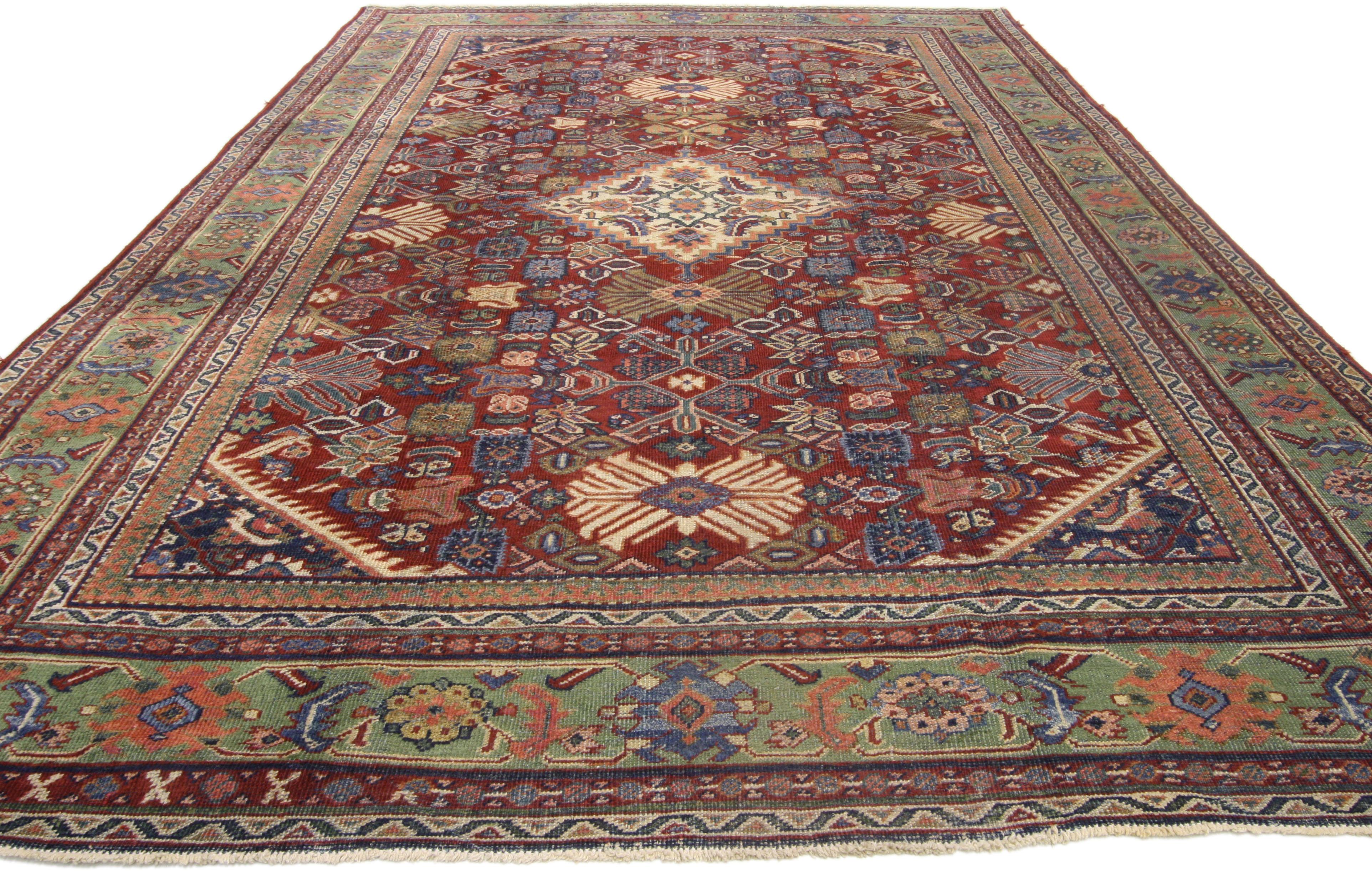 72659, antique Persian Mahal rug with rustic Gustavian Art Deco style. This hand knotted wool antique Persian Mahal rug features a stepped diamond medallion at its center. Geometric patterns fill the carpet field while serrated edge spandrels frame