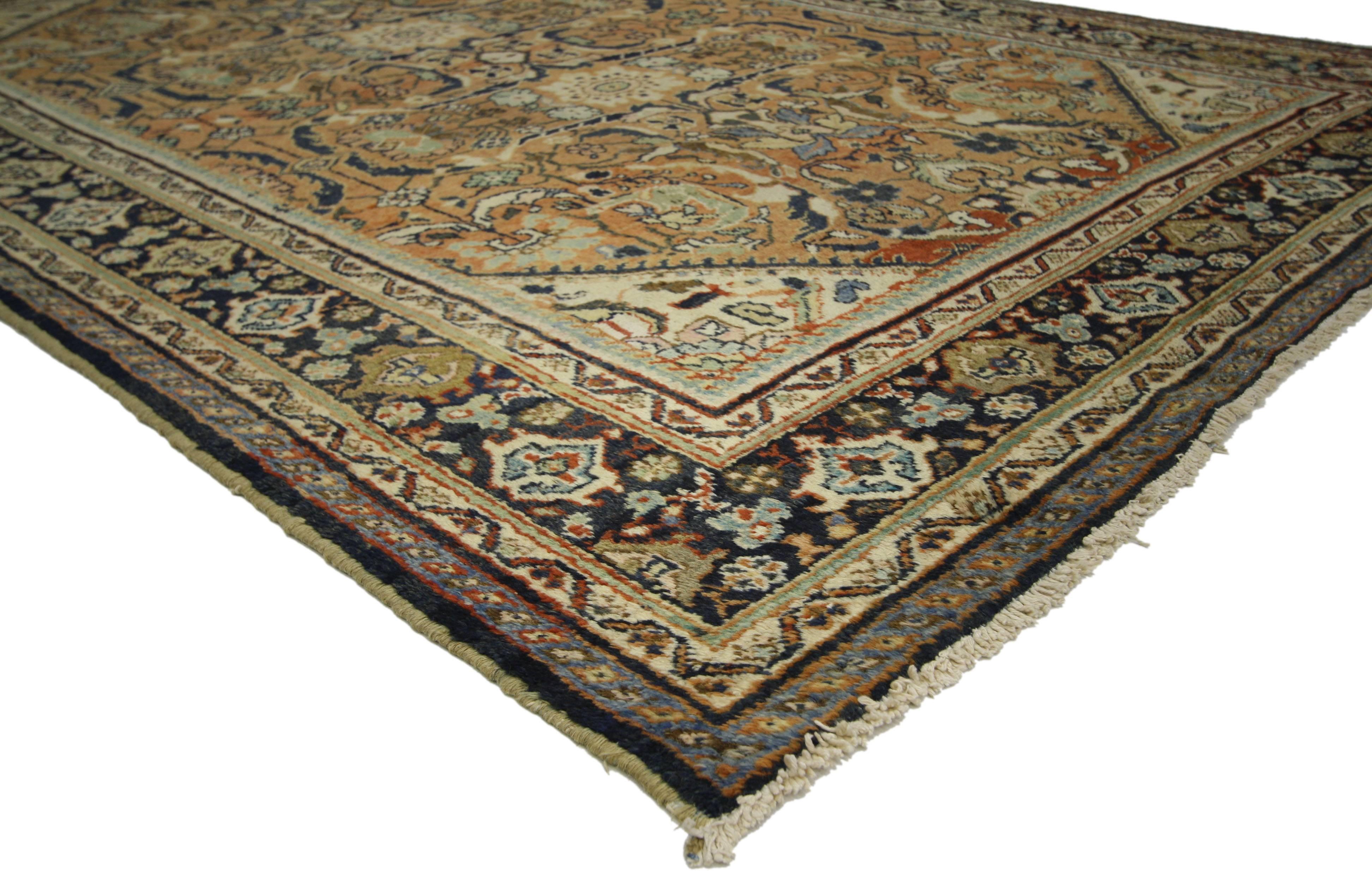 72732 antique Persian Mahal rug with warm, Bungalow Craftsman style. Warm and inviting, this hand knotted wool antique Persian Mahal beautifully embodies a Bungalow Craftsman style. The abrashed rust colored field is covered in an all-over botanical