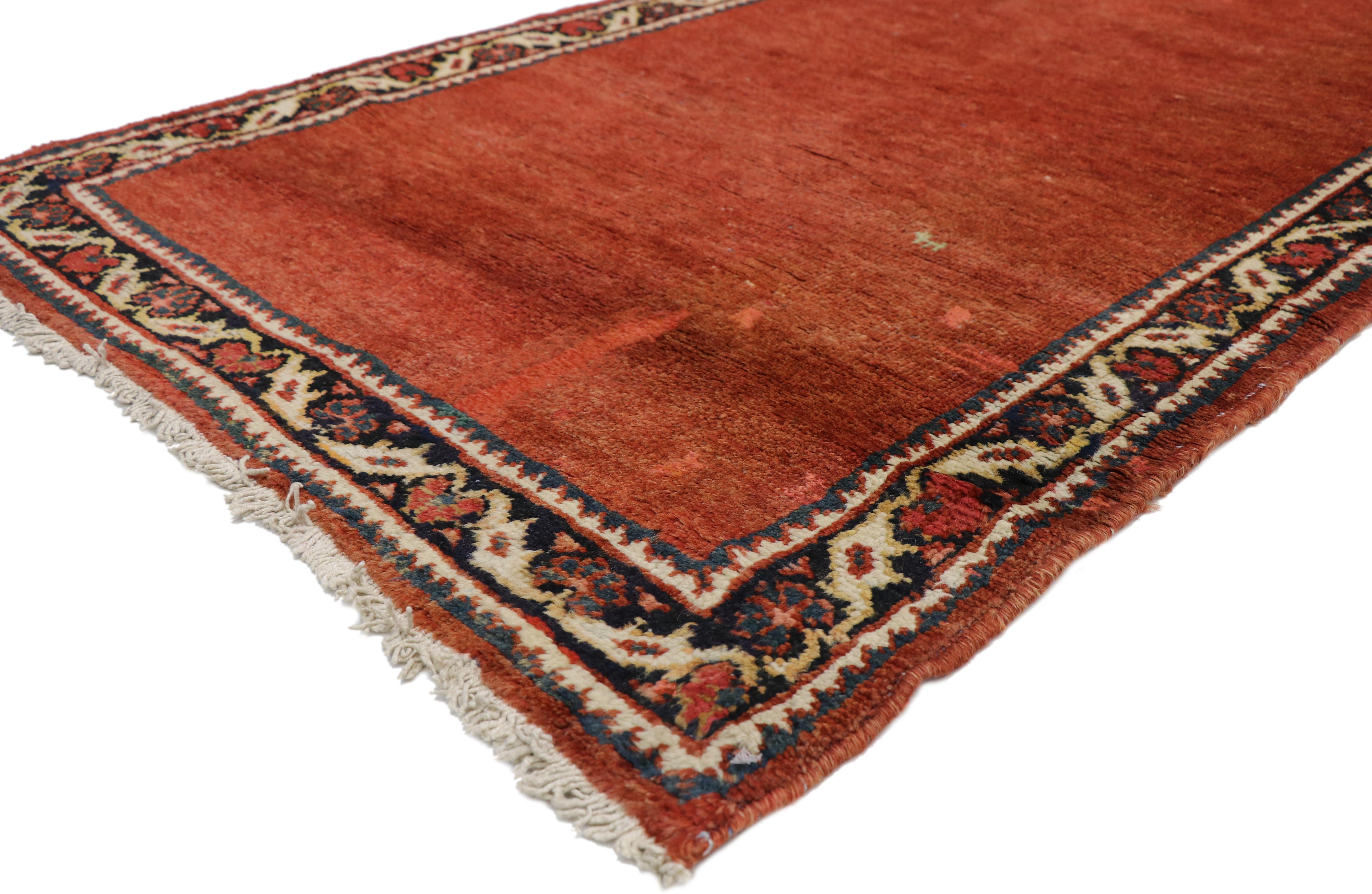 73232, antique Persian Mahal Runner in red with Manor House Tudor style. This incredibly rich antique Persian Mahal carpet runner features a modern traditional style, characterized primarily by the red field and equally impressive border. The bold
