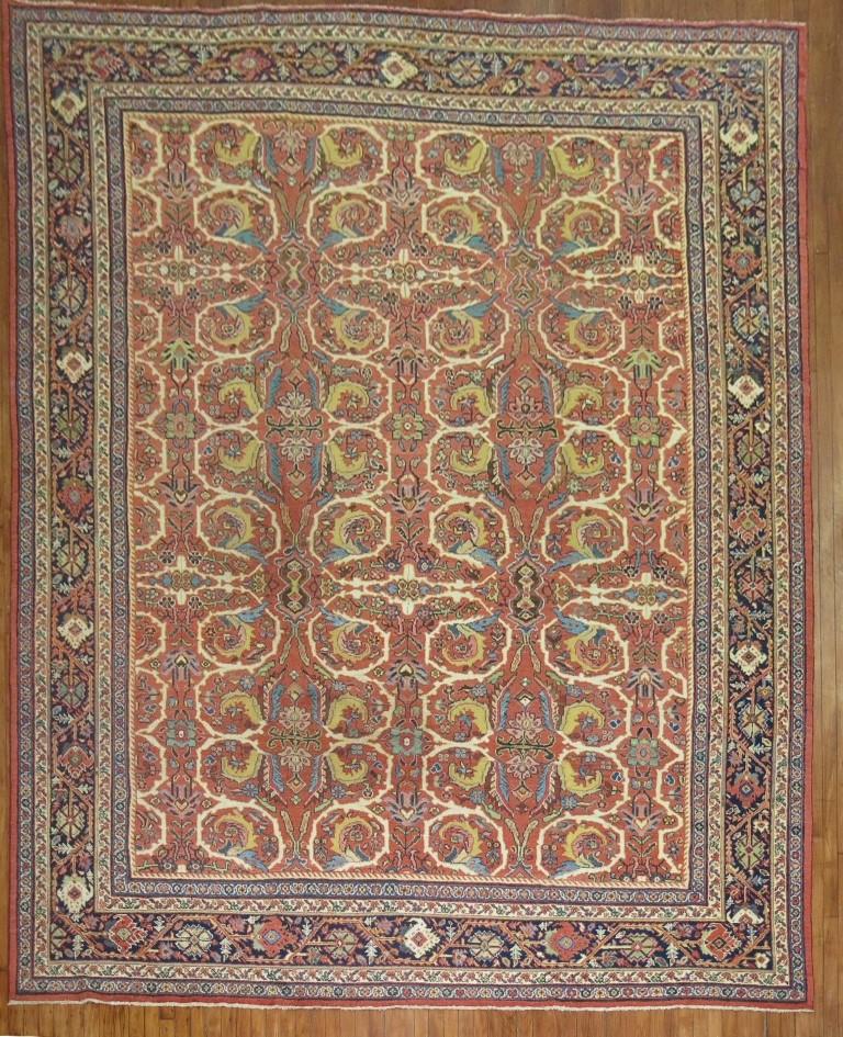 An antique Persian Mahal Sultanabad room-size decorative rug from the 1st quarter of the 20th century.

Measures: 10'4” x 13'8''.