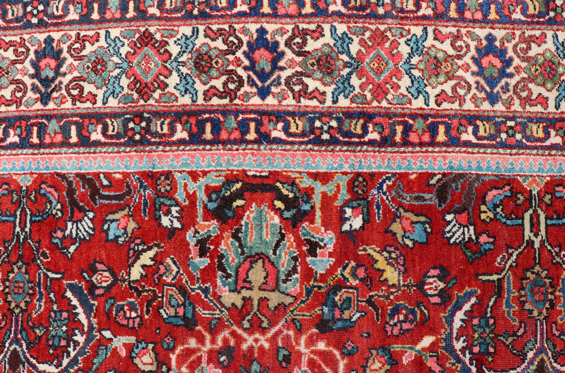 This Persian Mahal/Sultanabad features a symmetrical, all-over sub-geometric design. The entirety of the piece is enclosed within a complementary multi-tiered. border

Red background vintage Persian Mahal-Sultanabad, Keivan Woven Arts , rug