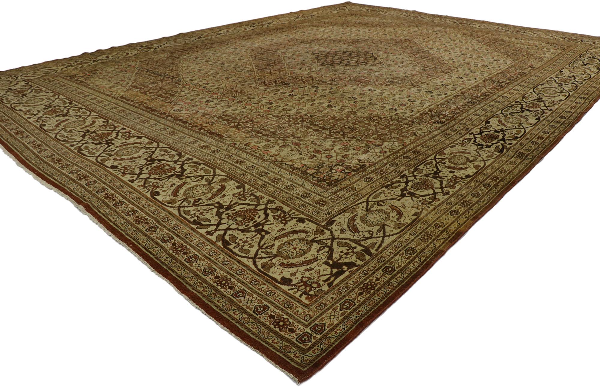 53173 antique Persian Mahi Tabriz rug with Modern Shaker style. 
Rustic sensibility meets earth-tone elegance in this hand knotted wool antique Persian Tabriz rug. The antique washed field features a hexagonal concentric medallion patterned with an