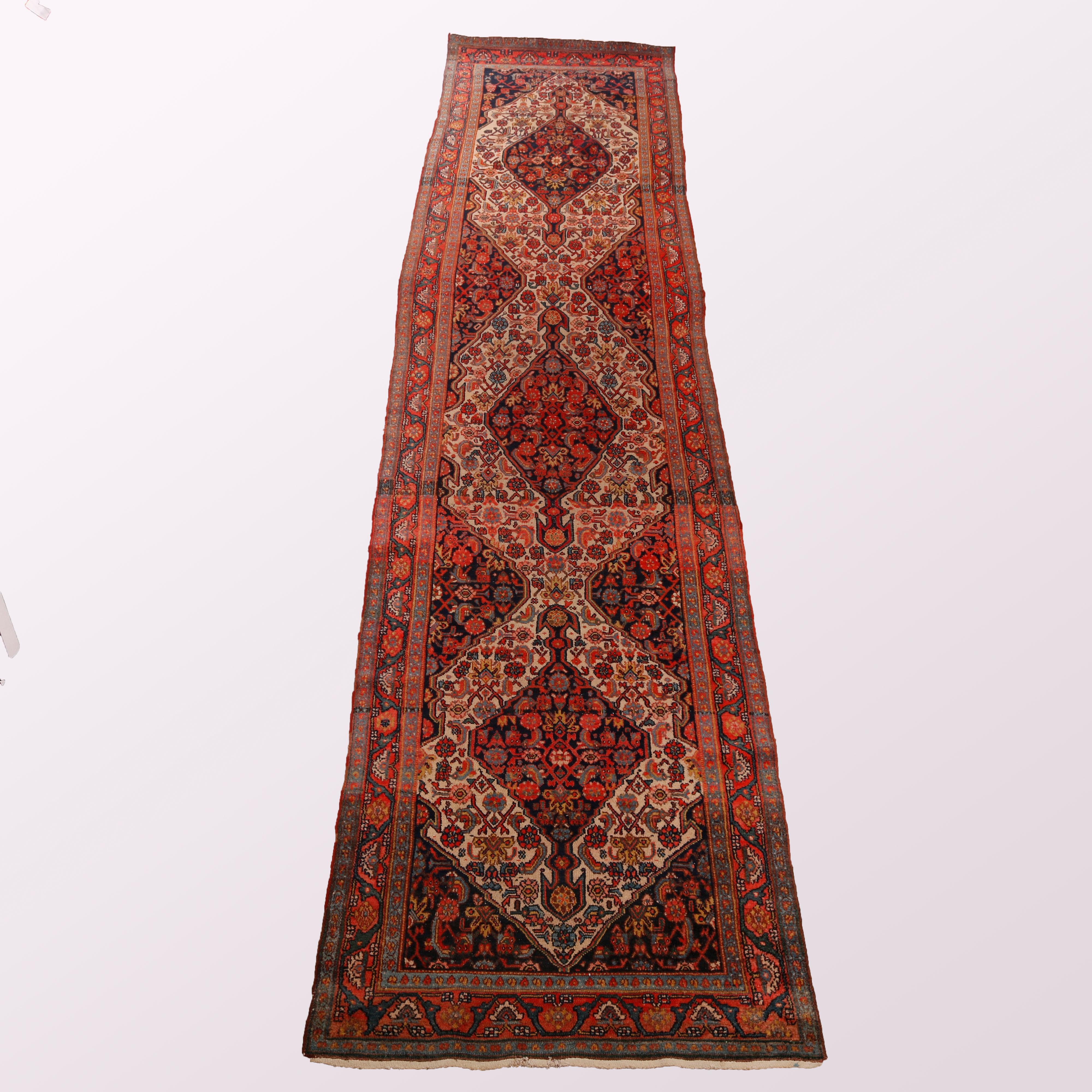An antique Persian Malayer oriental rug runner offers wool construction with triple diamond medallions and floral and foliate pattern, c1920

Measures - 16'3'' (195'') L x 42.25'' W x .5'' D.
 
Catalogue Note: Ask about DISCOUNTED DELIVERY RATES