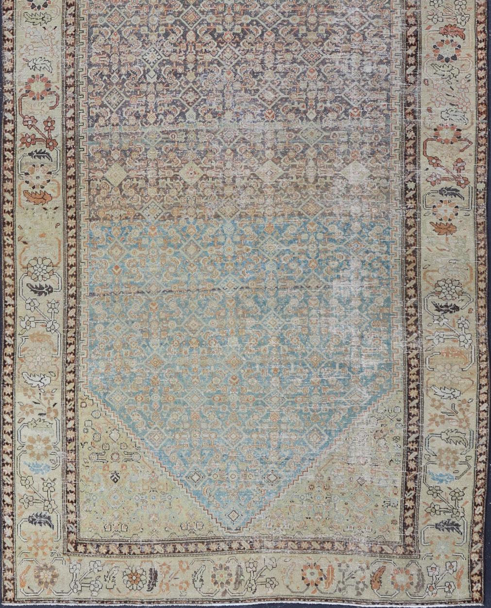 This antique Malayer is a beautiful piece displays a large medallion in the field, filled and surrounded by many motifs, accentuating the incredible detail in this piece. The wide border is banded by a floral motif design, wrapping around the entire