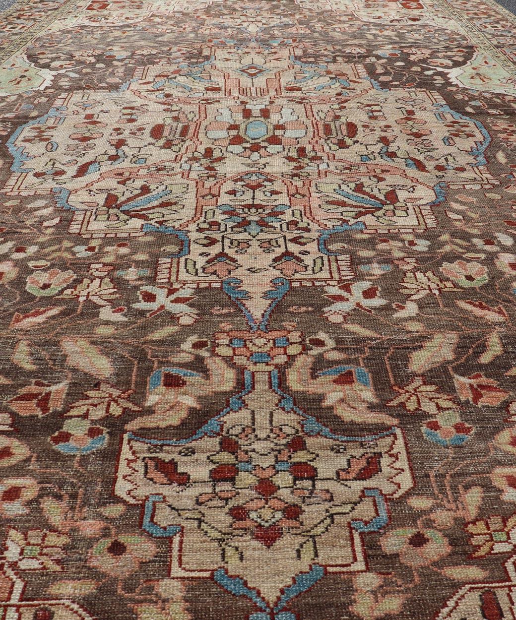 Antique Persian Malayer Gallery Rug with Large Floral Medallion With Soft Colors. Keivan Woven Arts / rug W22-0402-15478, country of origin / type: Iran / Malayer, circa 1920.
Measures: 6'8 x 12'9 
This multicolored Antique Persian Malayer wide