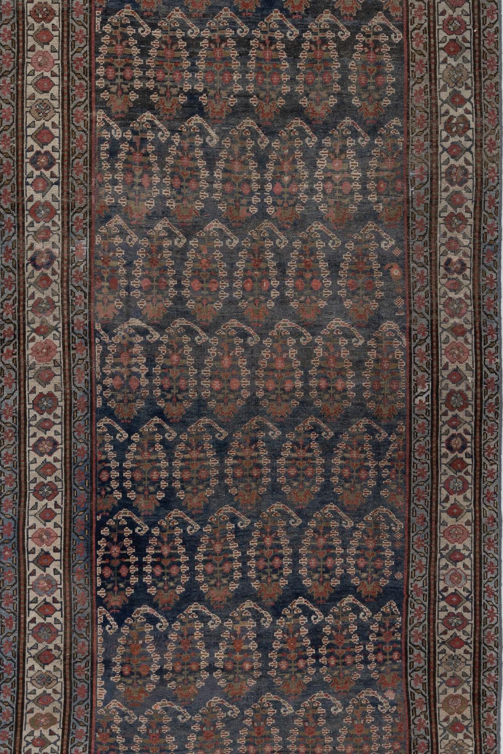 Circa: early 20th century
Pile: Low-medium
Wear Notes: 2
Stunning deep blue field Malayer with a sea of detailed boteh that consist of individual symbols themselves.

Wear Guide:
Vintage and antique rugs are by nature, pre-loved and may show