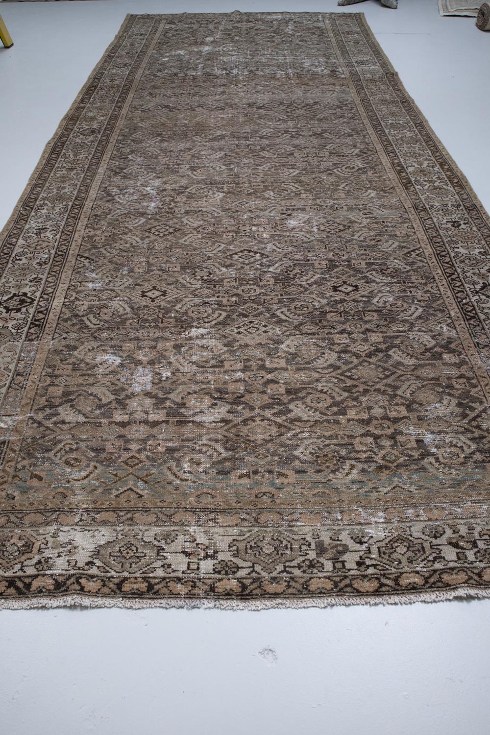 Early 20th Century Distressed Antique Persian Gallery Rug For Sale