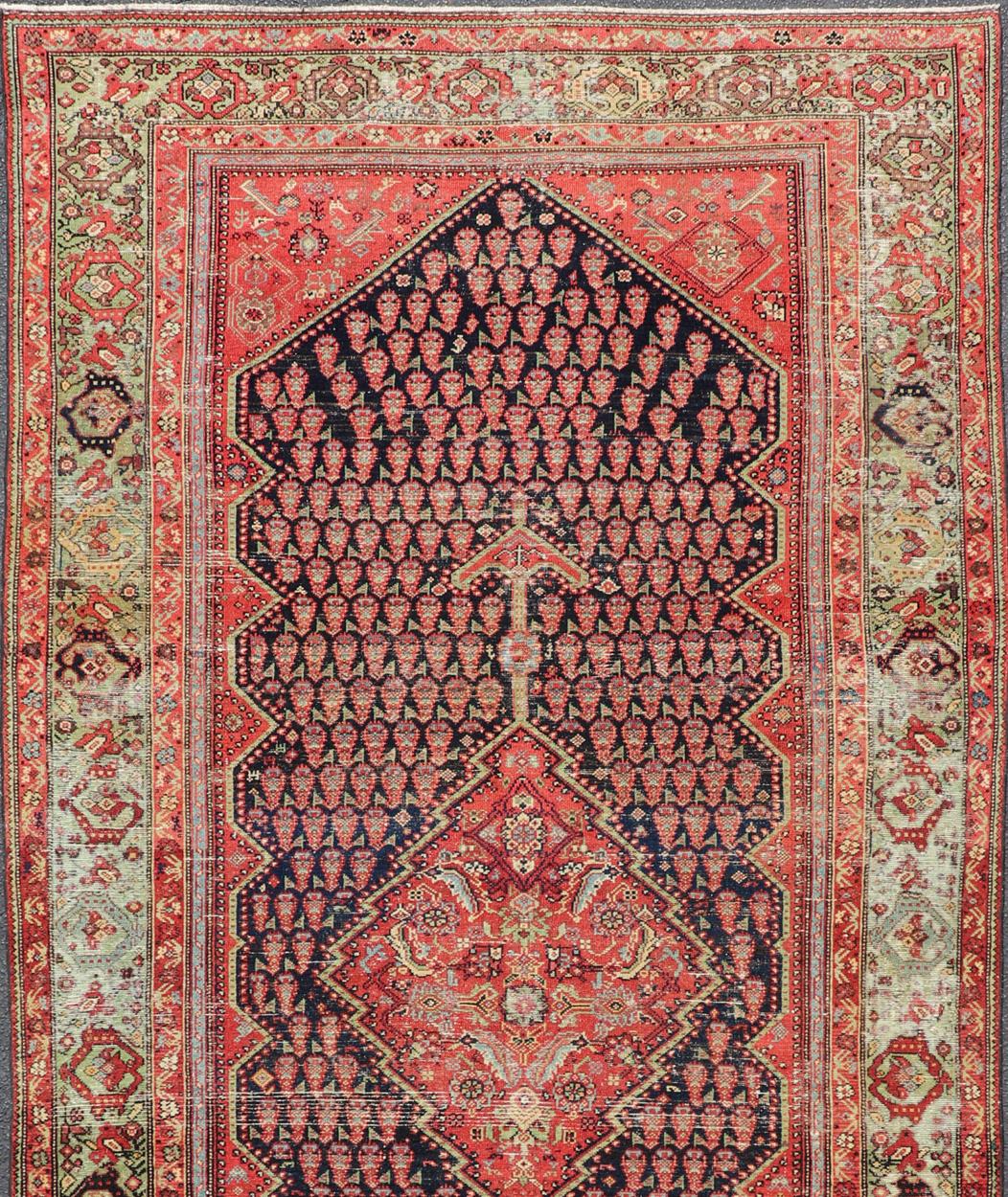 20th Century Antique Persian Malayer Gallery Runner with Small All-Over Design with Medallion For Sale