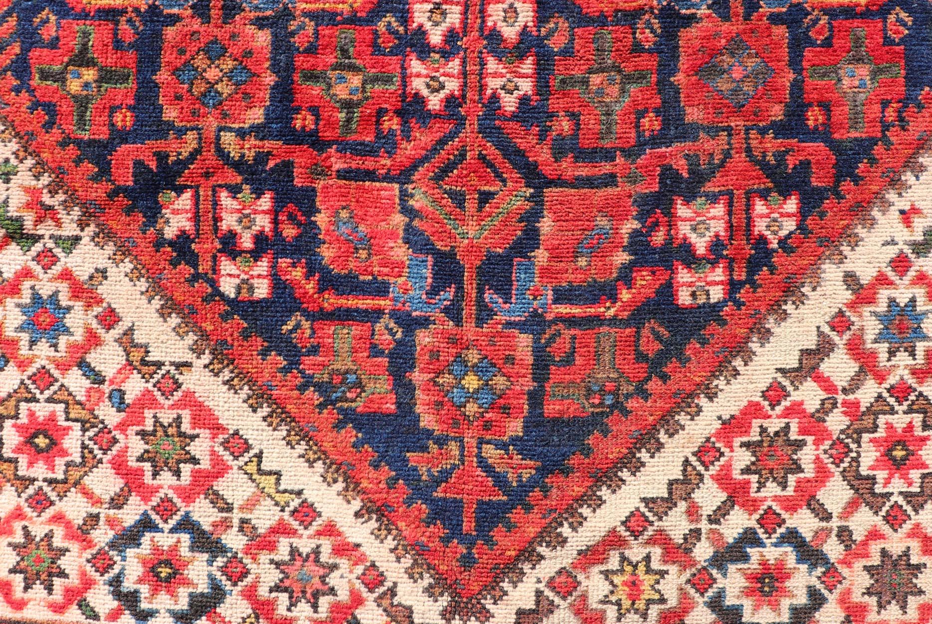 Malayer Gallery runner from Persia with geometric floral central field design, in red and blue with all over design. Keivan Woven Arts / rug PTA-21020, country of origin / type: Iran / Malayer, circa 1930.

Measures: 4'11 x 11'5.