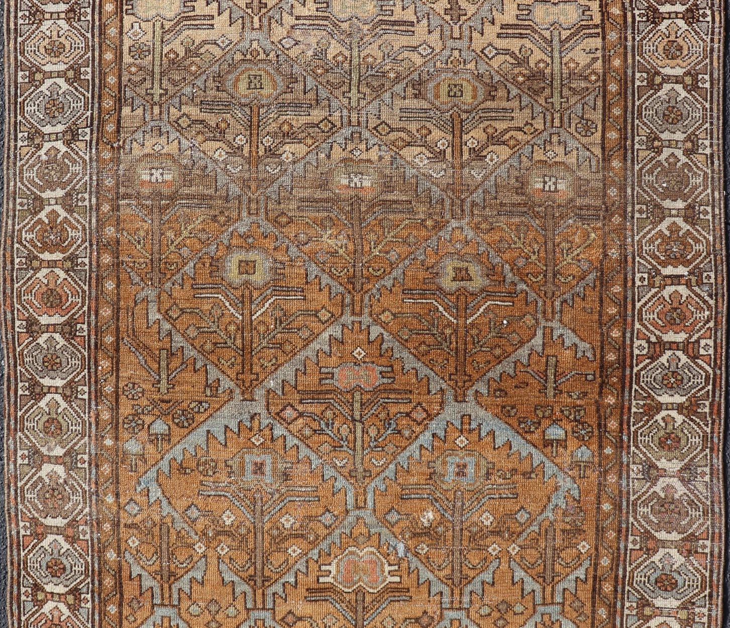 Antique Persian Malayer in Rustic Earthy Tones With All-Over Tribal Medallions. Country of Origin: Iran Type: Malayer.  All-Over, Medallion, Keivan Woven Arts; rug V21-1203 : Persian Rug, early 20th Century
Measures: 4'0 x 5'4 
This antique Persian