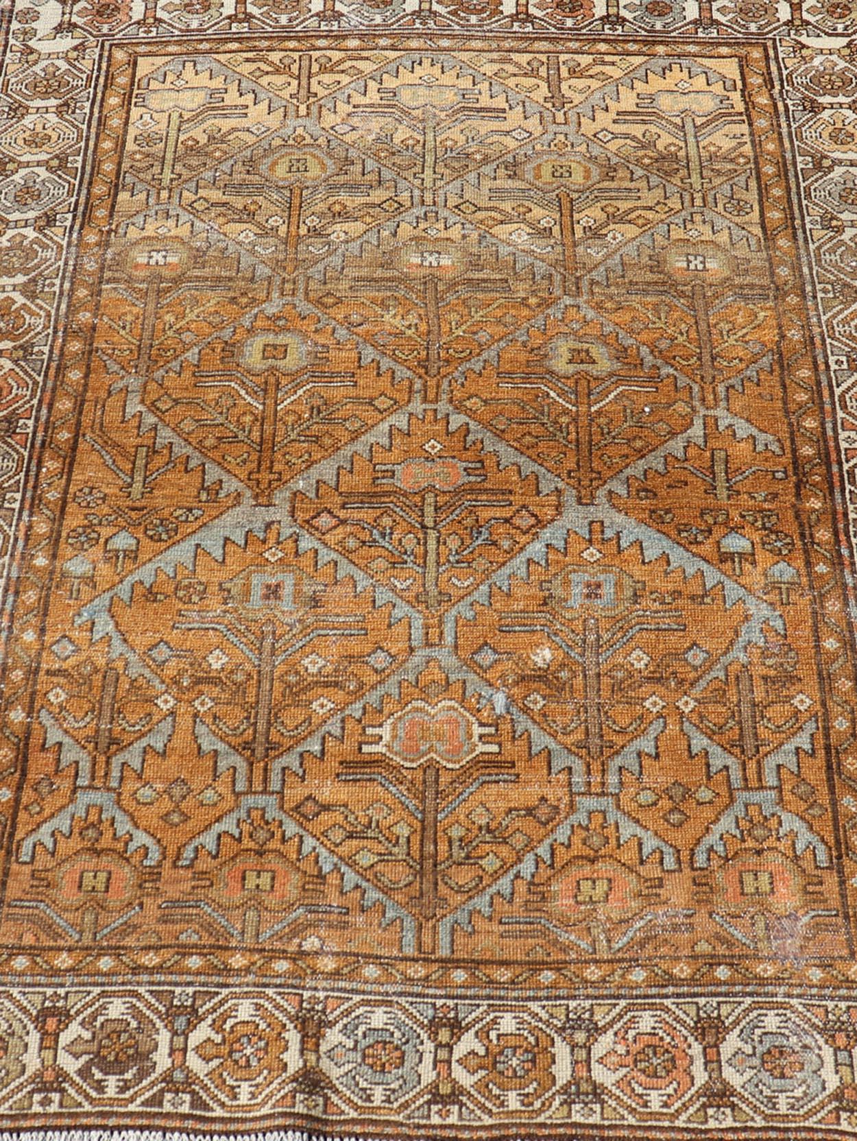 Antique Persian Malayer in Rustic Earthy Tones With All-Over Tribal Medallions In Good Condition In Atlanta, GA