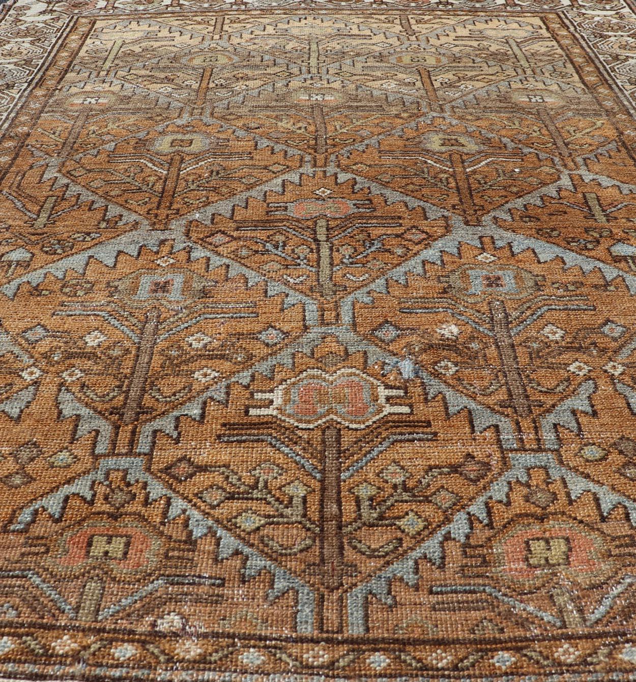 20th Century Antique Persian Malayer in Rustic Earthy Tones With All-Over Tribal Medallions