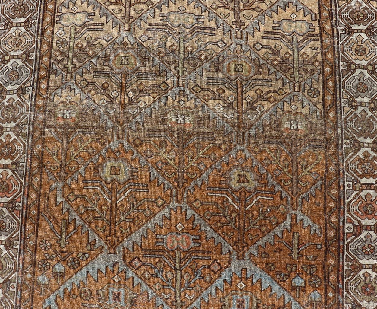Wool Antique Persian Malayer in Rustic Earthy Tones With All-Over Tribal Medallions