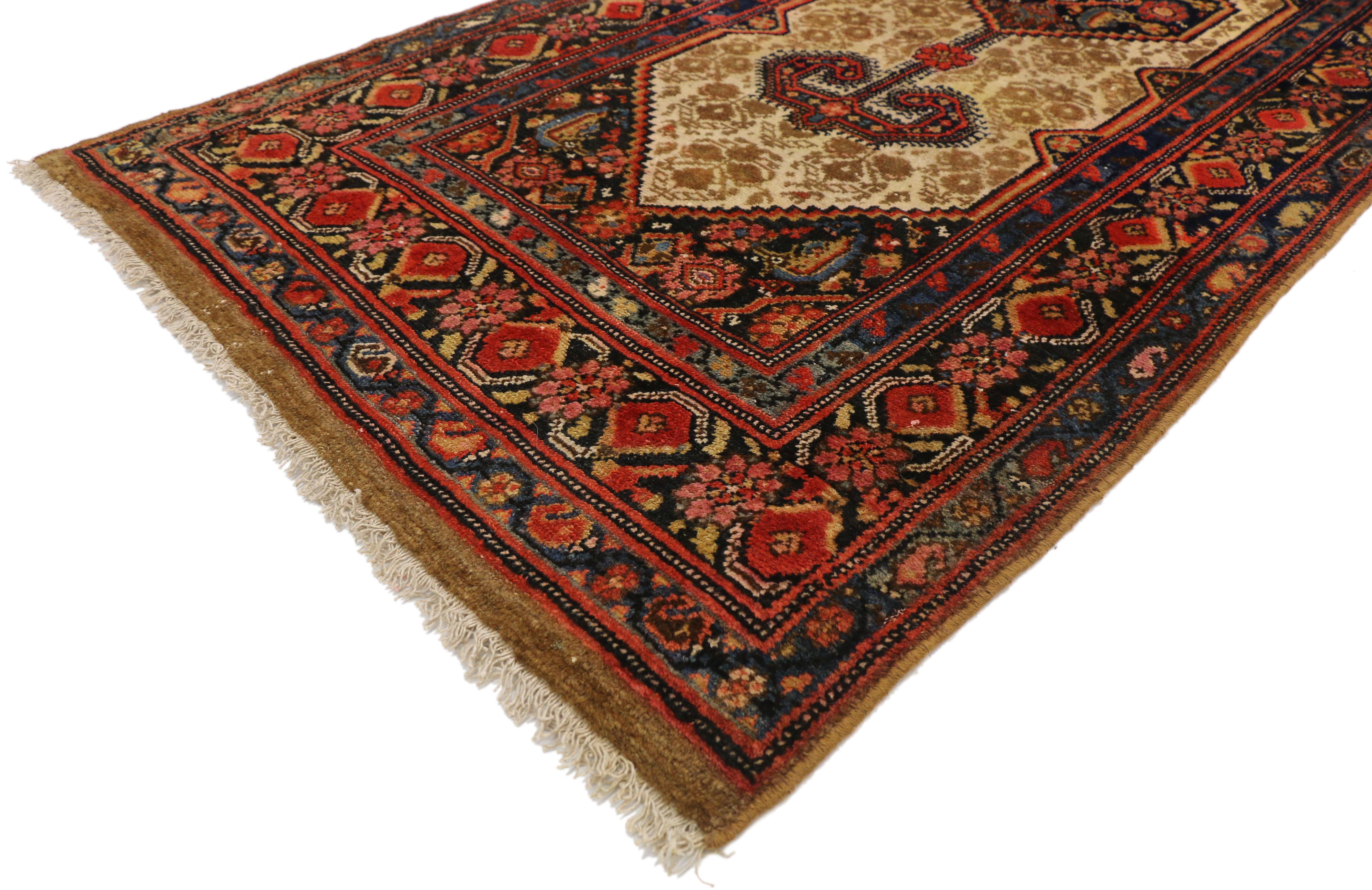 77292 antique Persian Malayer long hallway runner with Tudor Manor House style. This hand knotted wool antique Persian Malayer runner features amulet medallions with a Herati pattern and outlined with zigzag and jagged edges flanked with Ram's horn