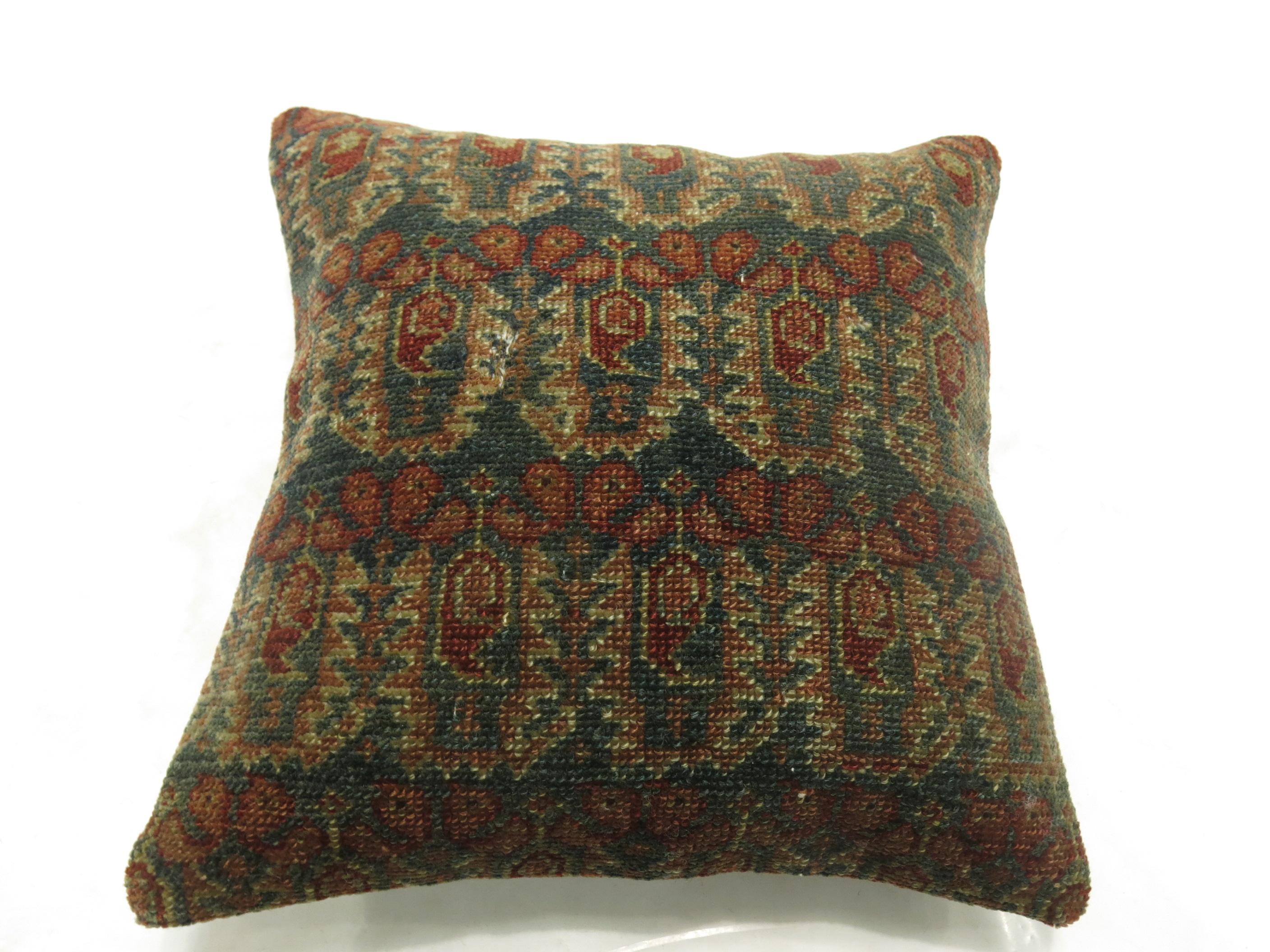 Pillow made from an antique Persian Malayer rug.