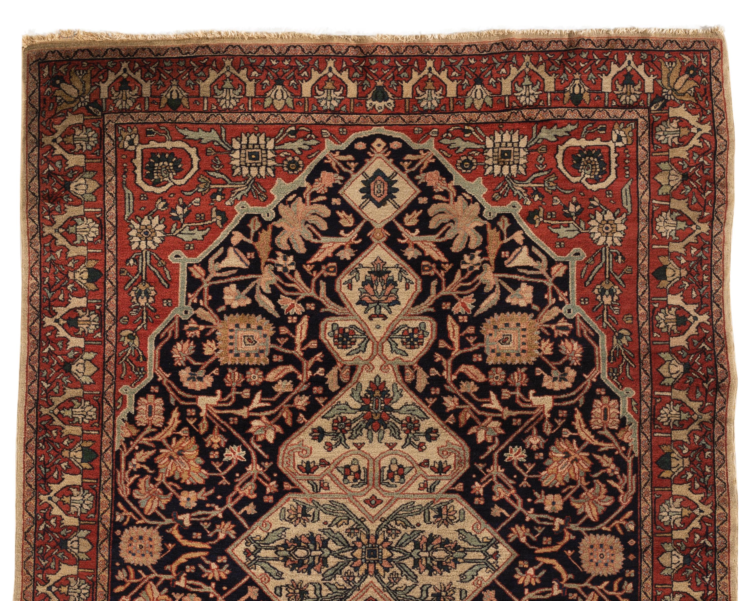 Antique Persian Malayer rug, circa 1890. Antique rugs from Malayer, east of Hamadan, could be considered top quality Hamadan’s and they share similar structural aspects. This lovely small scatter rug has a deep navy field filled with an array of