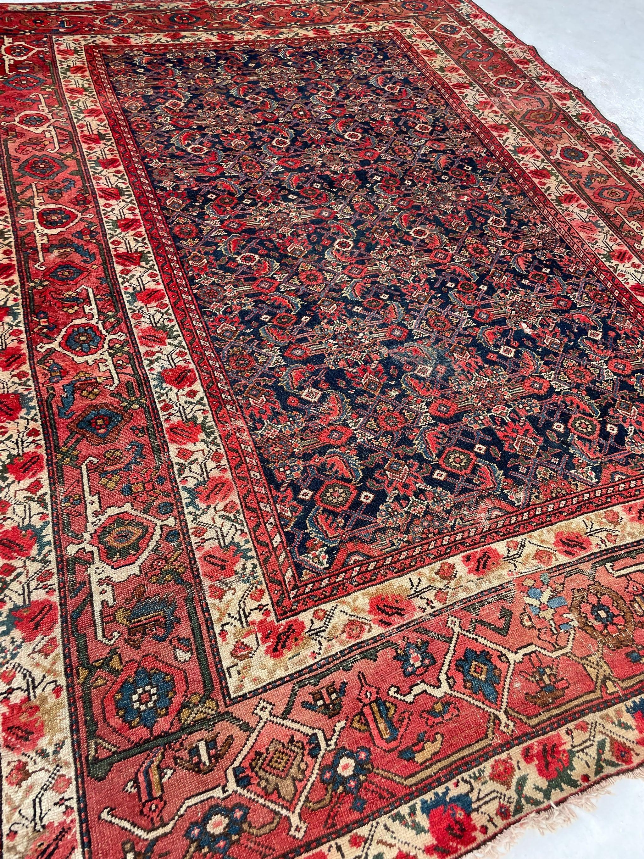 Fine Antique Persian Malayer with Several Designs Herati Field with Serapi Border

Size: 6.10 x 9.10
Age: Antique; C. 1920-30's
Pile: Low with wonderful age-related patina; some subtle color run in a few areas with some very small and