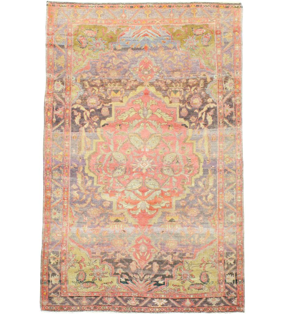 An antique Persian Malayer carpet from the first quarter of the 20th century.