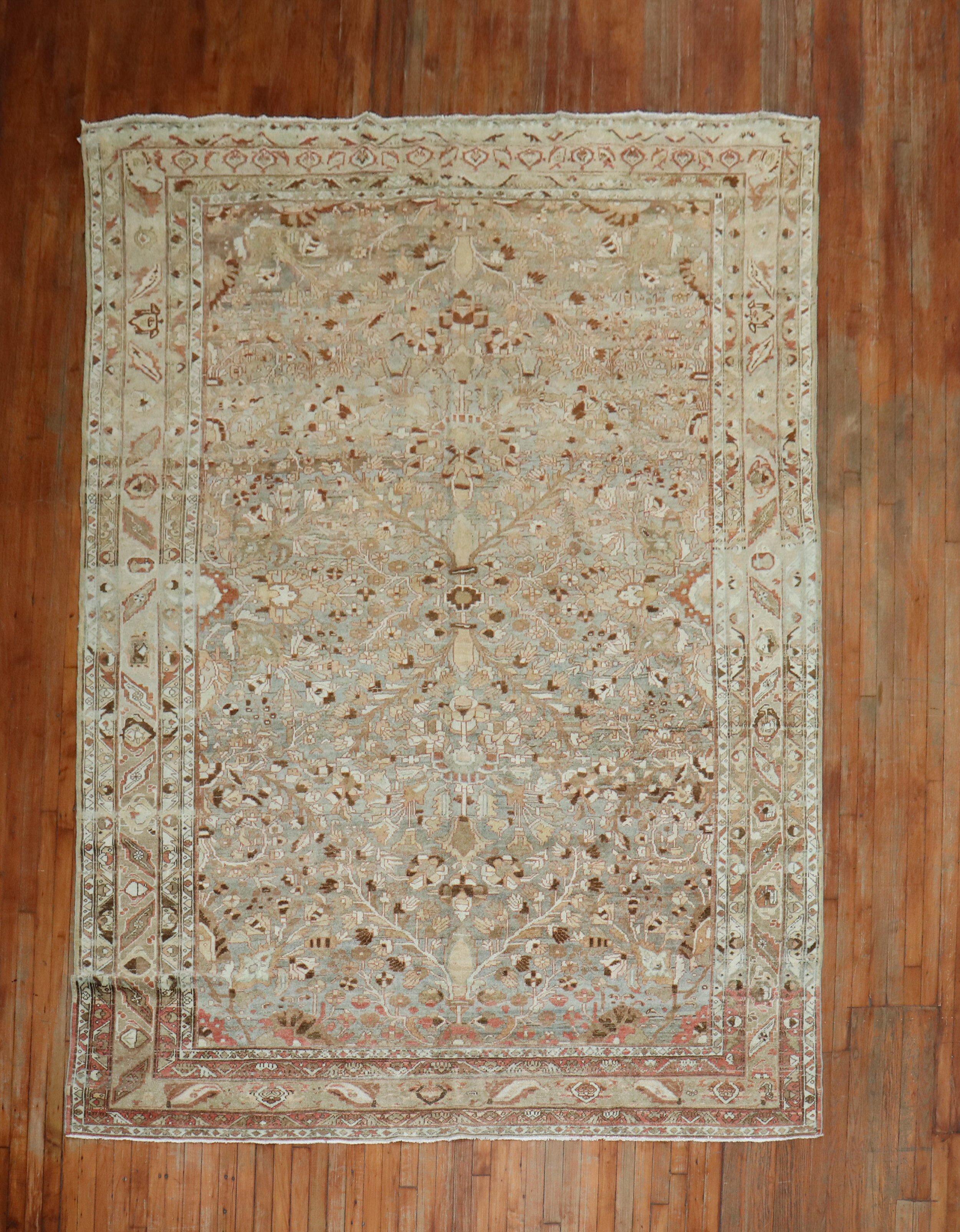 An antique Persian Malayer rug with an all-over design on a gray abrashed ground, accents in rust, caramel, ivory and brown

Measures: 8' x 11'6''.