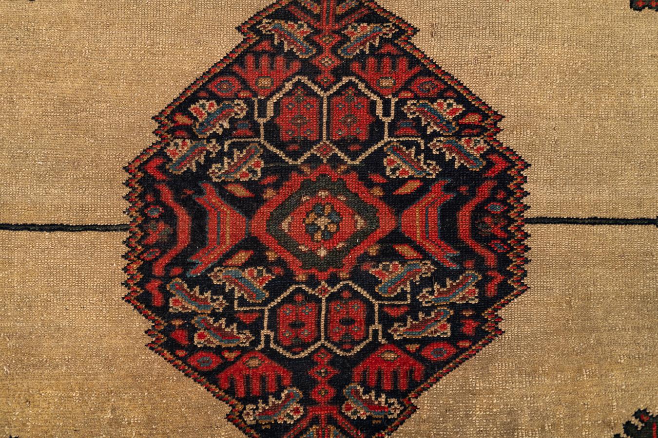 Malayer – Northwest Persia

This surprising Malayer stands out for its rare format – unusually wide. The artistic combination of colours is sublime: cobalt blue, saffron, and numerous shades of red. The central medallion is located in a spacious